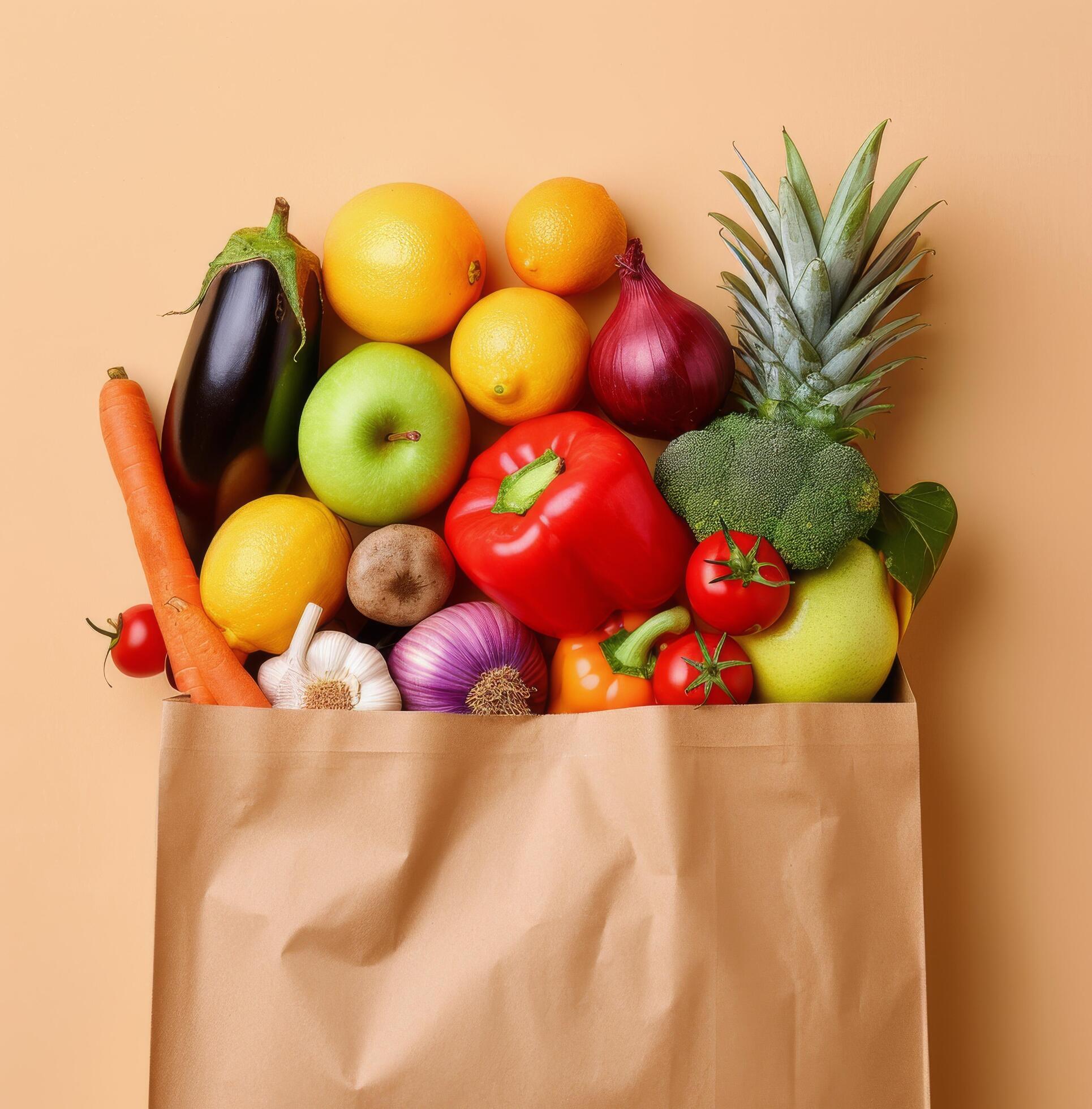 Fresh Produce Bag Filled With Colorful Fruits and Vegetables on Light Brown Background Stock Free