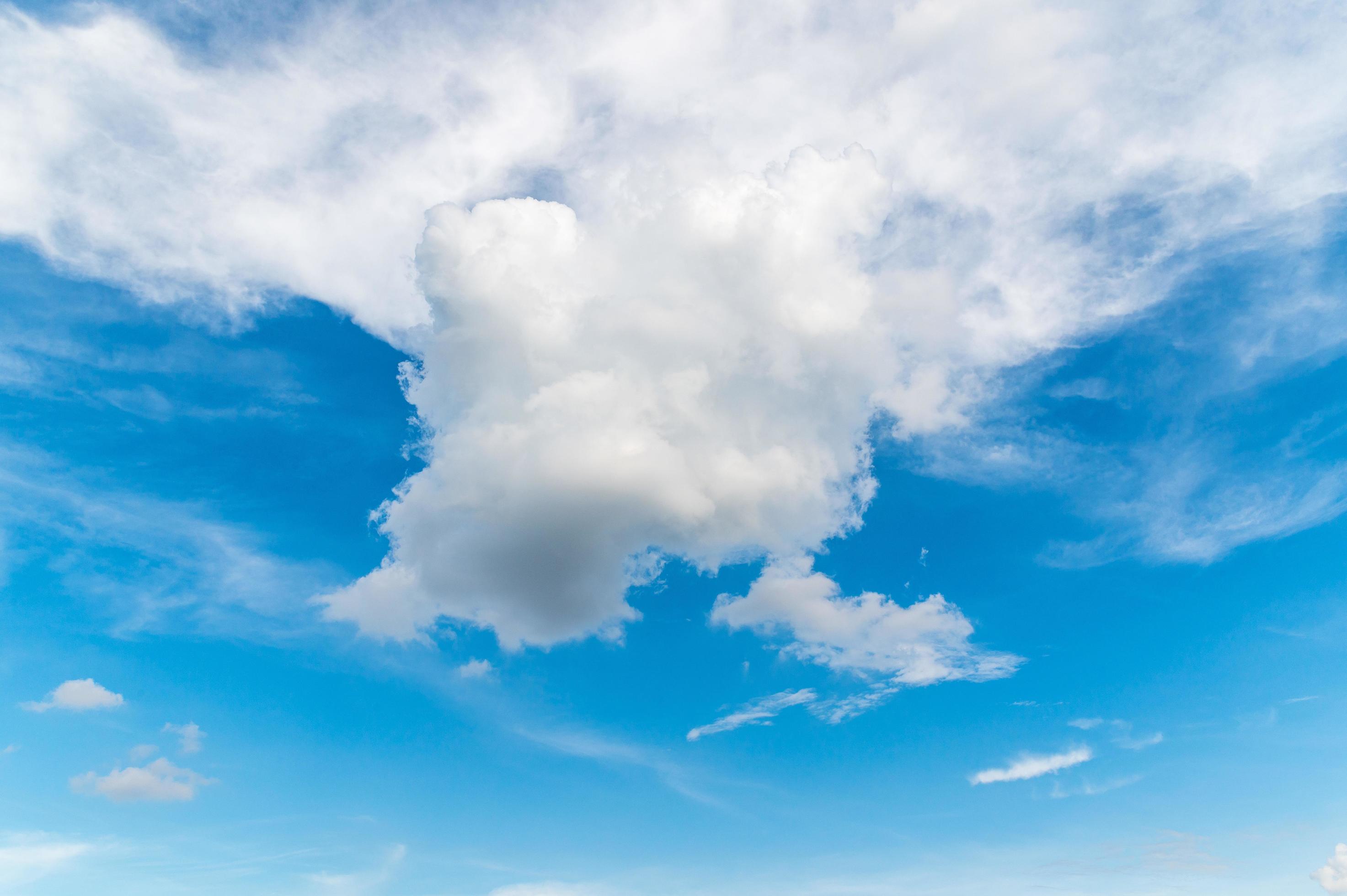 Beautiful white fluffy clouds in blue sky. Nature background from white clouds in sunny day Stock Free