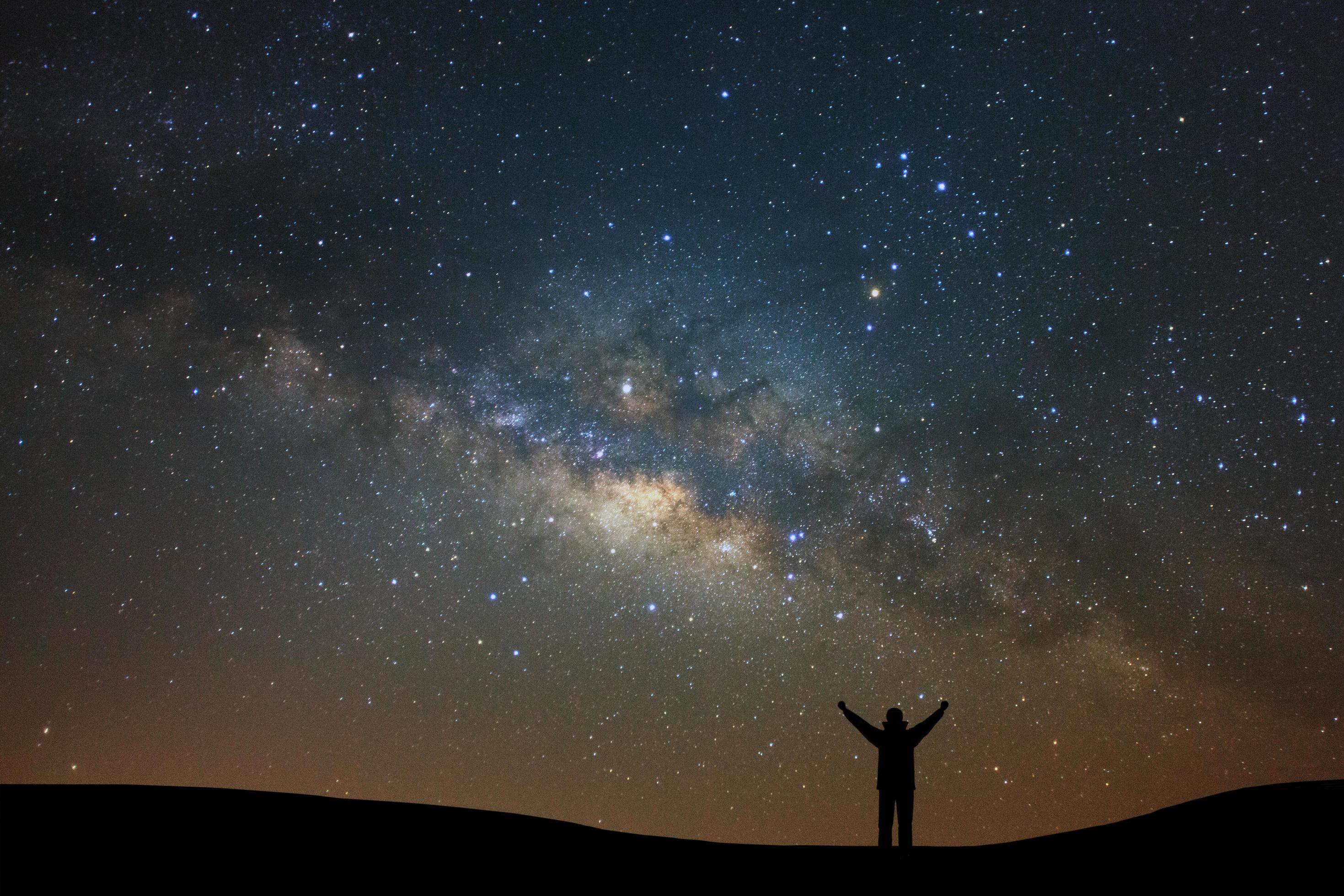 Night landscape with milky way and silhouette of high mountain, Starry sky with stars. Beautiful universe. Space background Stock Free