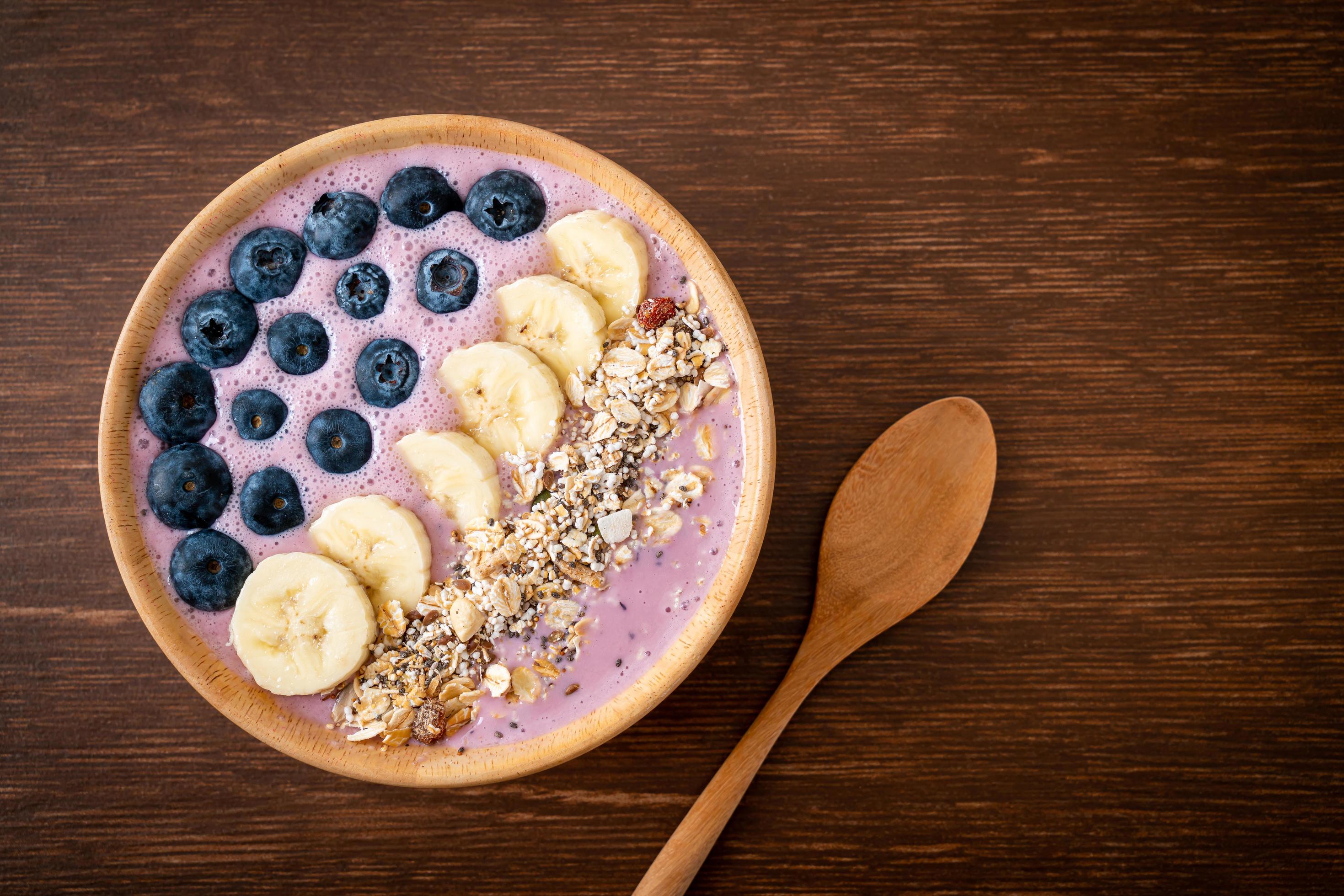 Yogurt or smoothie bowl with blueberry, banana, and granola – Healthy food style Stock Free