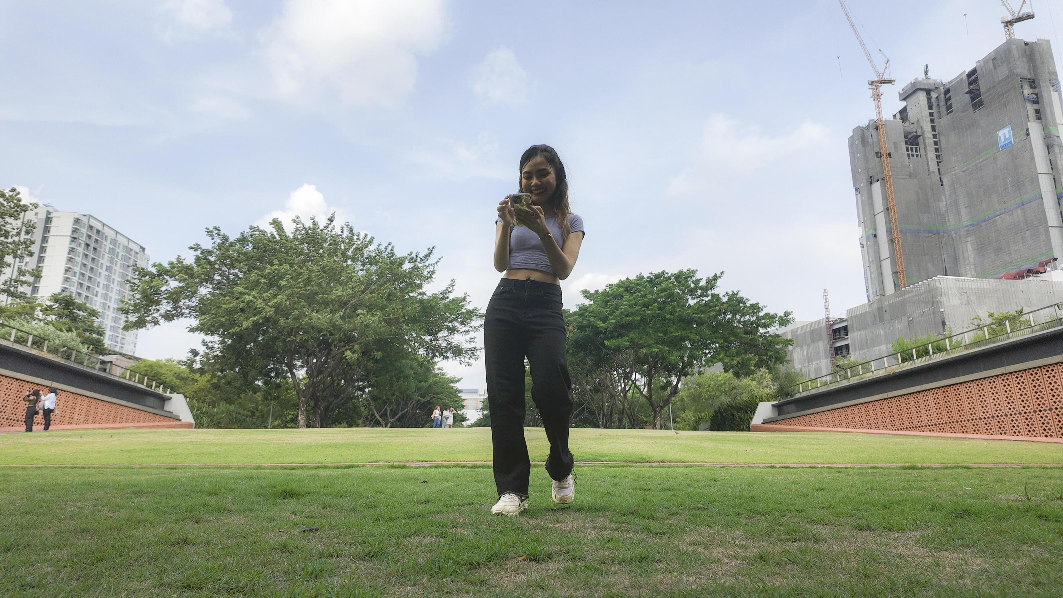 Asian women do freestyle hip hop and breakdancing in a public space in the middle of the city. With a cheerful and happy attitude Stock Free