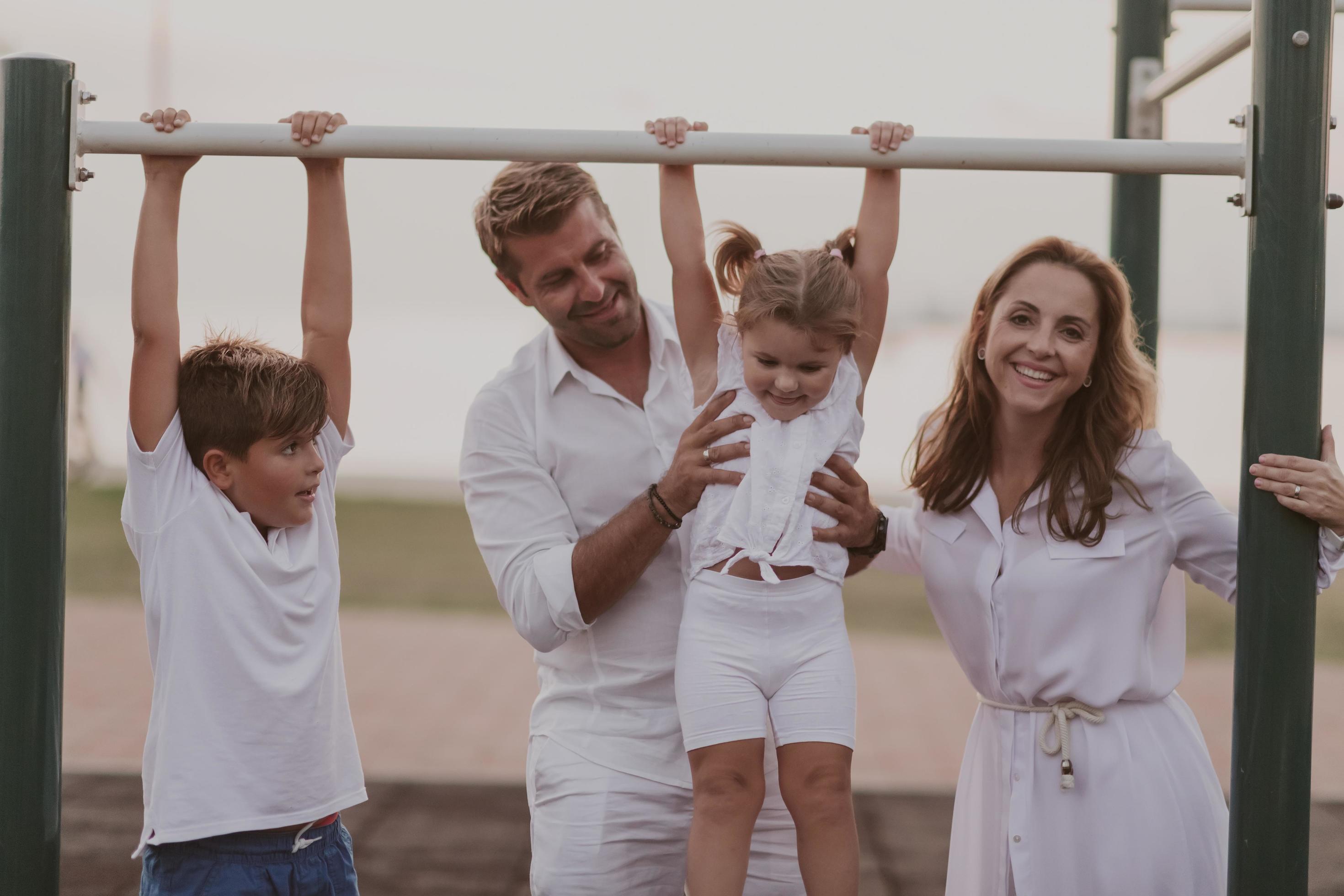 Senior couple in casual clothes with their children spending time in park a vacation together. Family time . Selective focus Stock Free