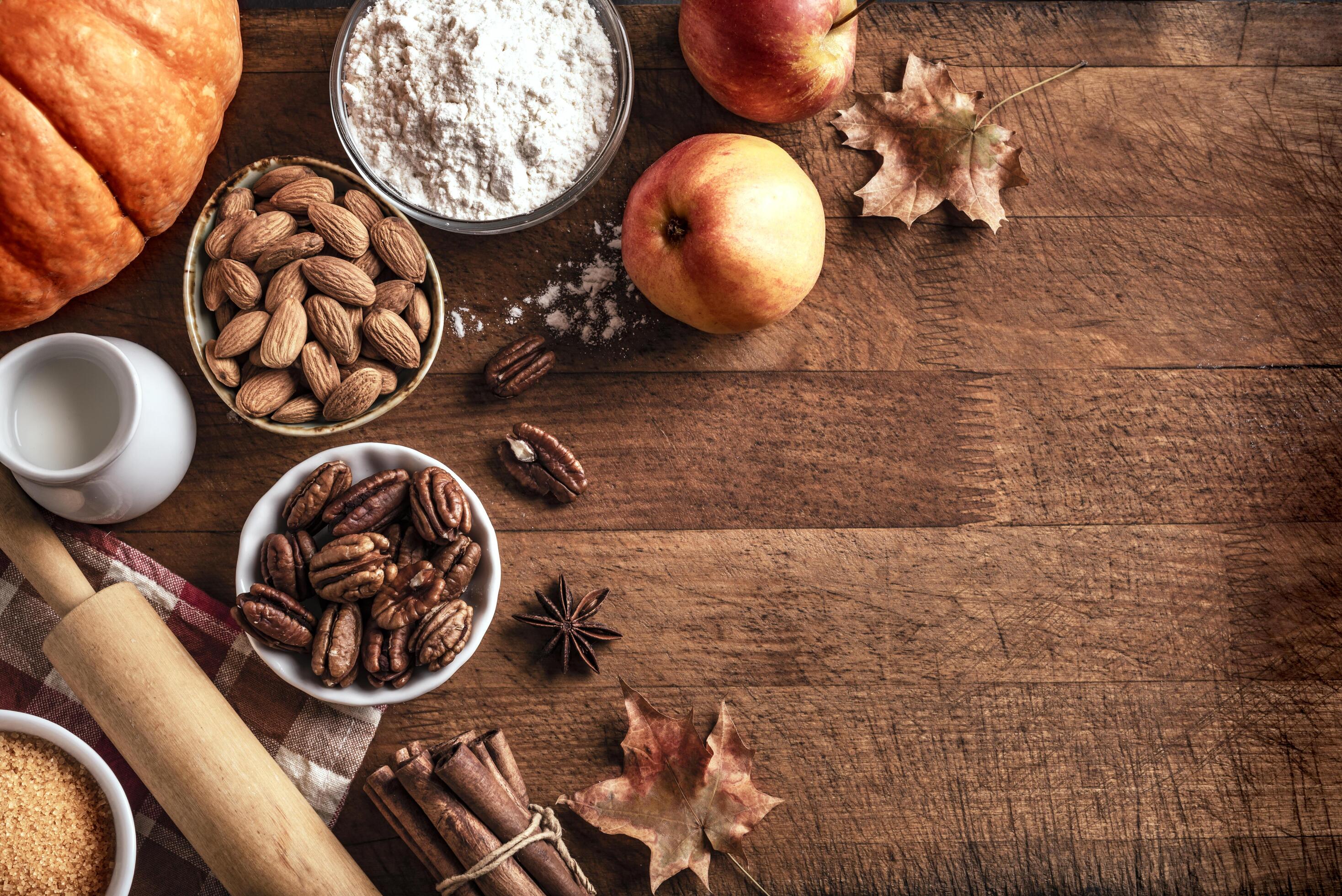 Autumn baking background with pumpkins, apples and nuts Stock Free