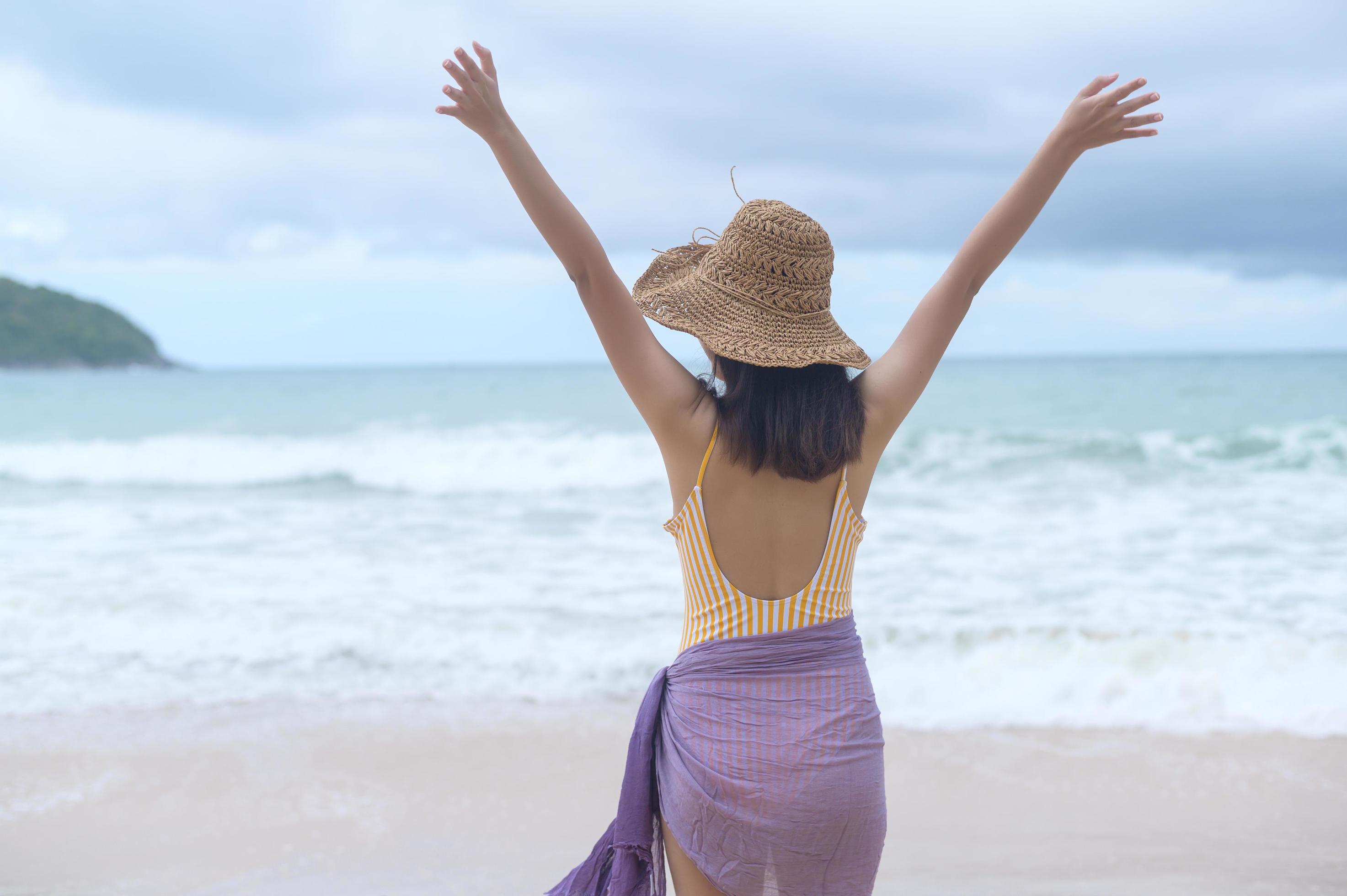 Young Beautiful woman in Bikini enjoying and relaxing on the beach, Summer, vacation, holidays, Lifestyles concept. Stock Free