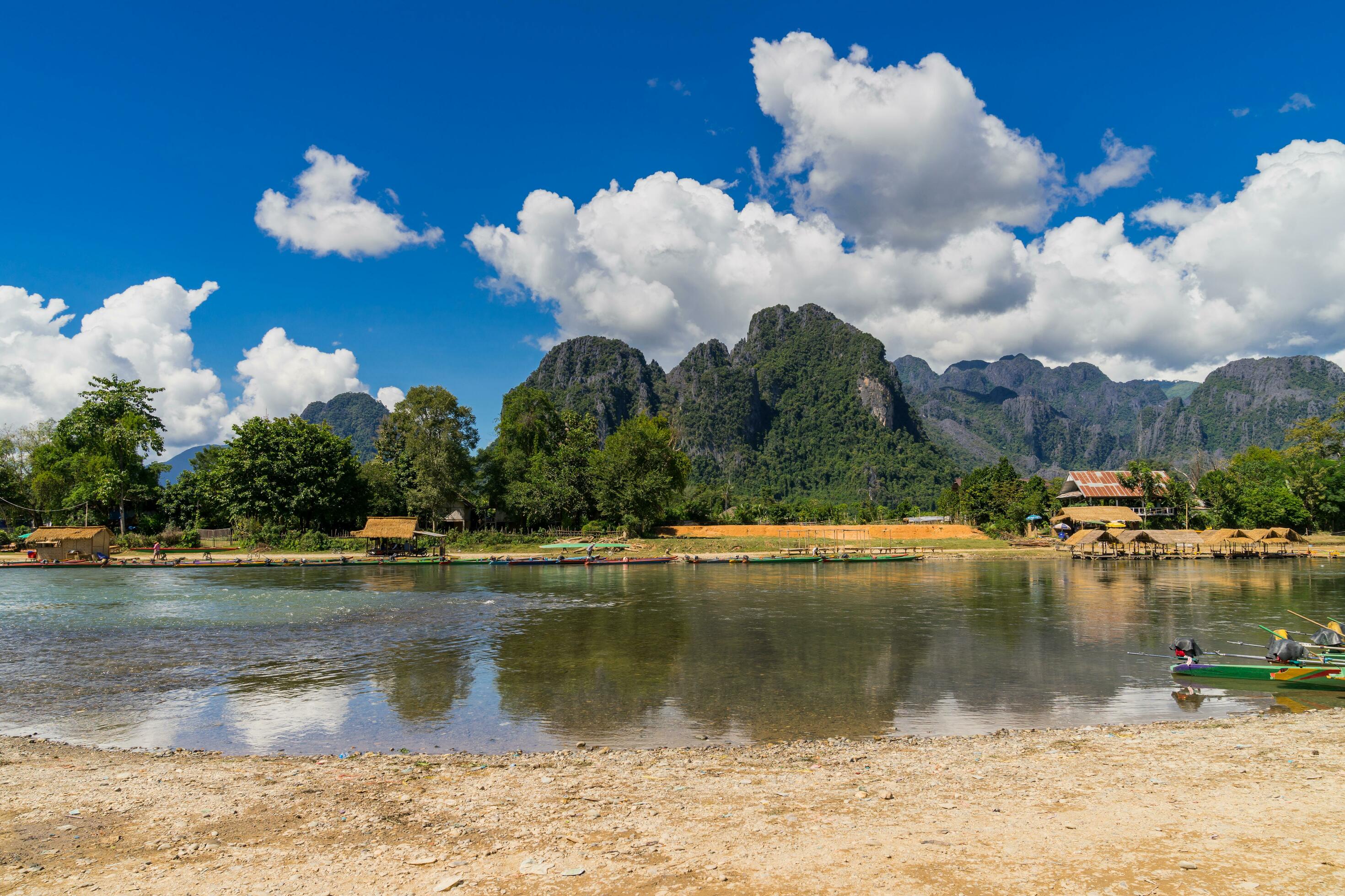 
									long tail boats on sunset at Song river, Vang Vieng, Laos. Stock Free