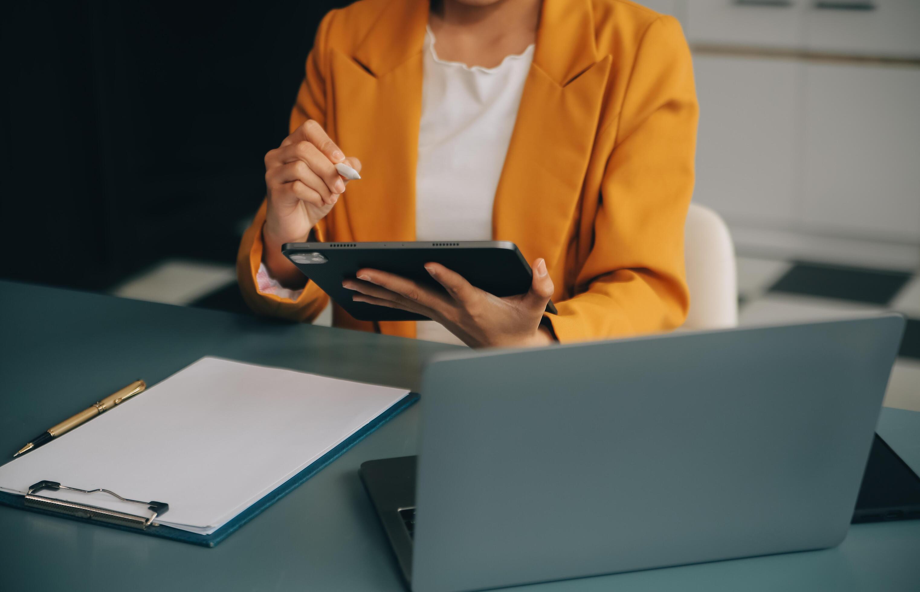 Portrait of a successful business woman using digital tablet Stock Free