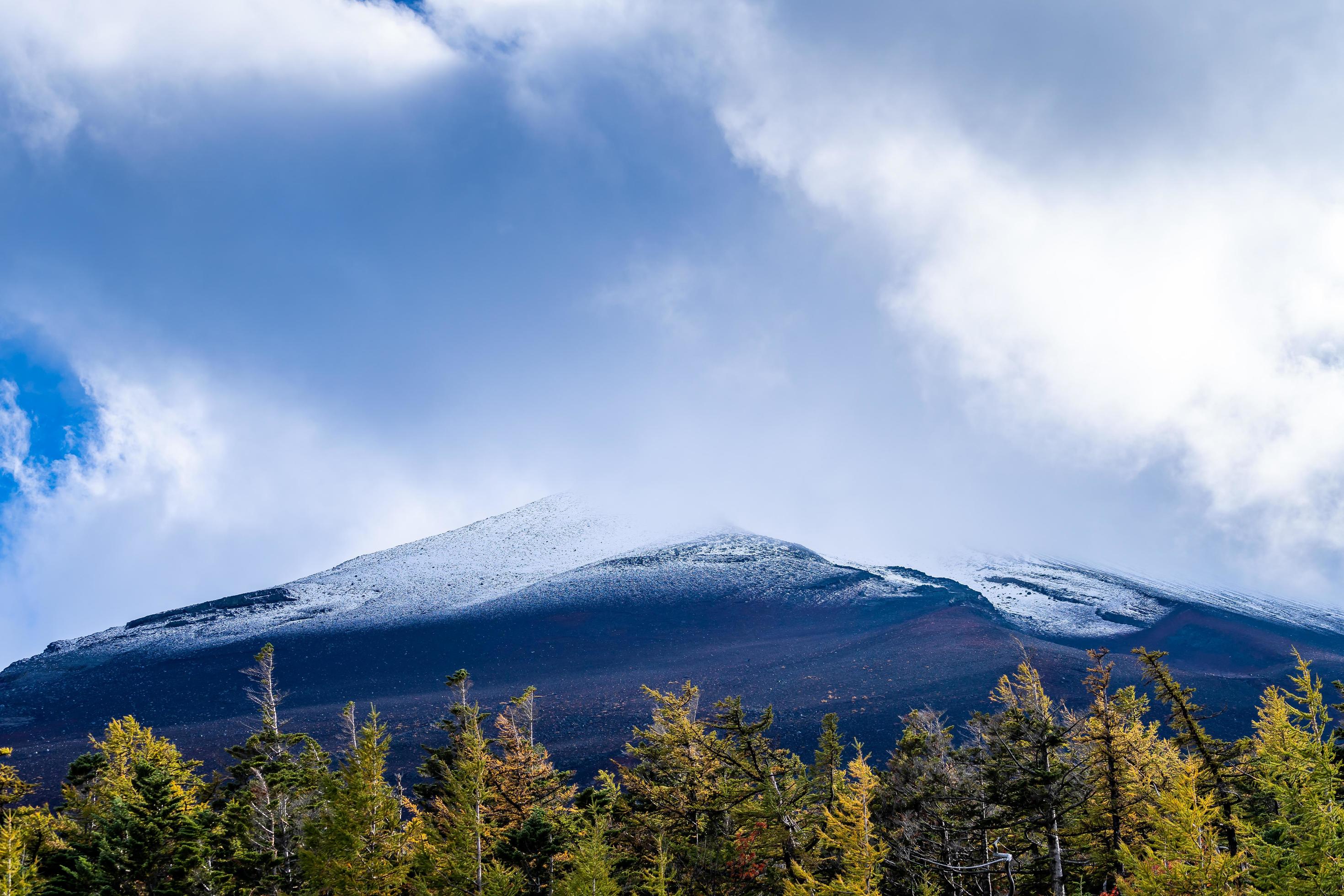 Close up top of Fuji mountain with snow cover and wind on the top with could in Japan. Stock Free