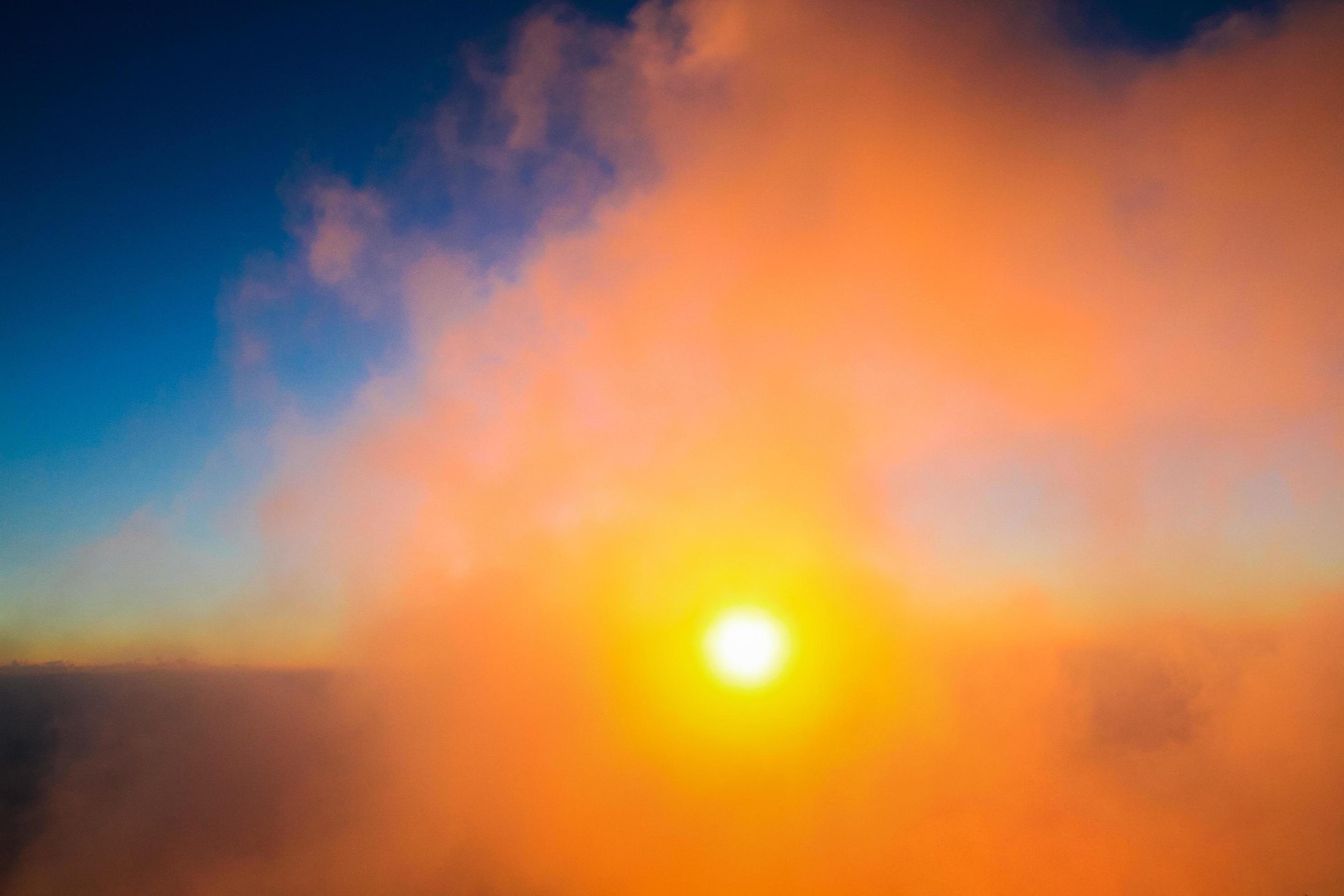 Sunset in sky and cloud, beautiful colorful twilight time with silhouette of mountain. Stock Free