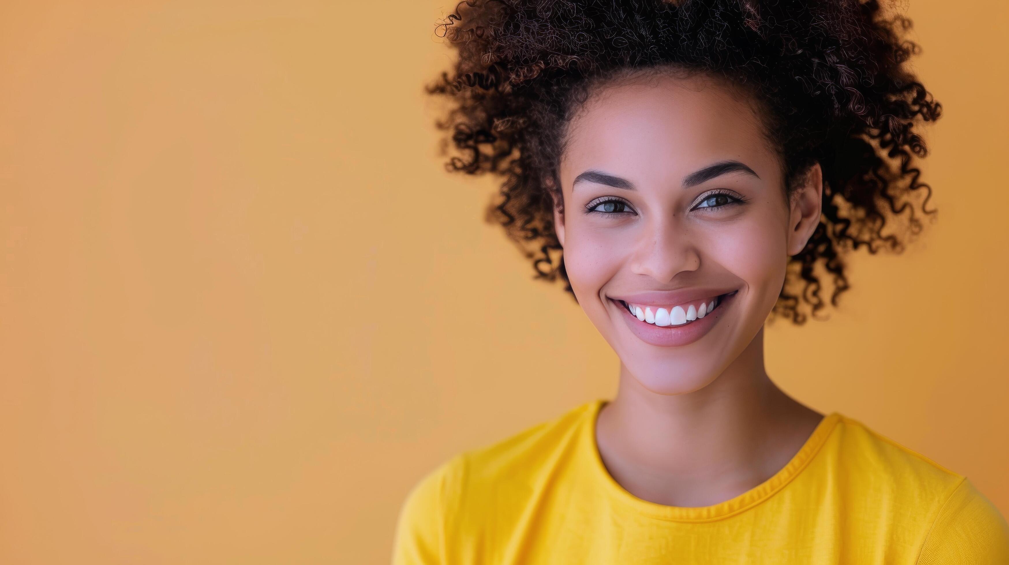 Smiling Woman in Yellow Shirt With Pink Headband Against Colorful Background Stock Free