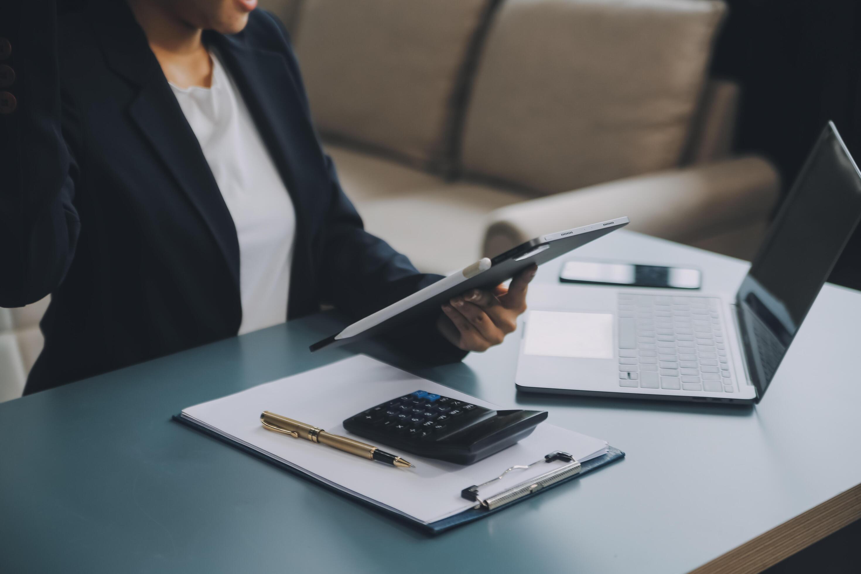 Portrait of a successful business woman using digital tablet Stock Free