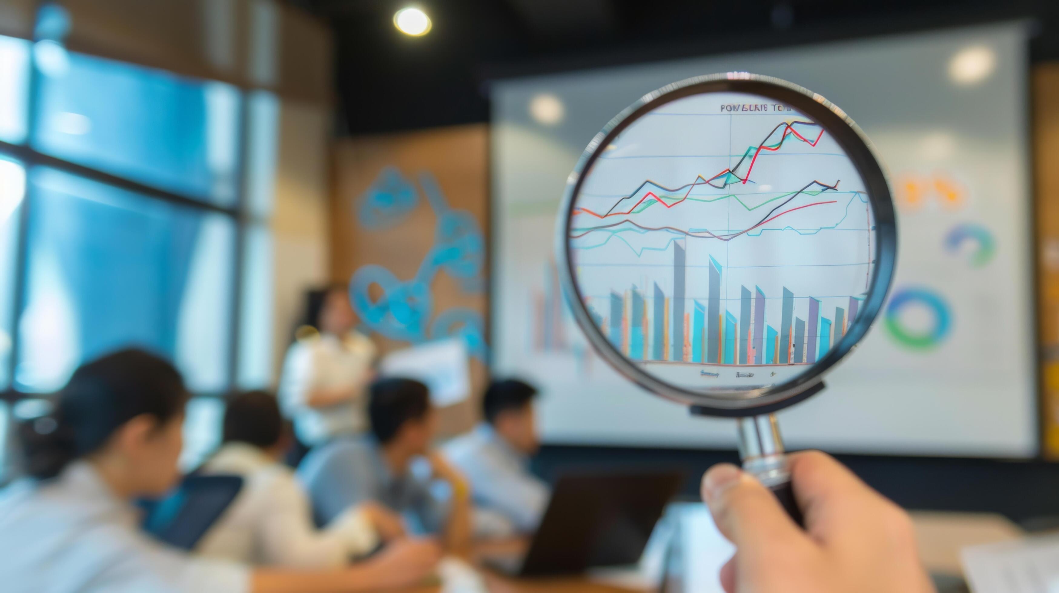 Close-Up of Magnifying Glass Focused on Stock Market Indicators with Blurred Background Stock Free