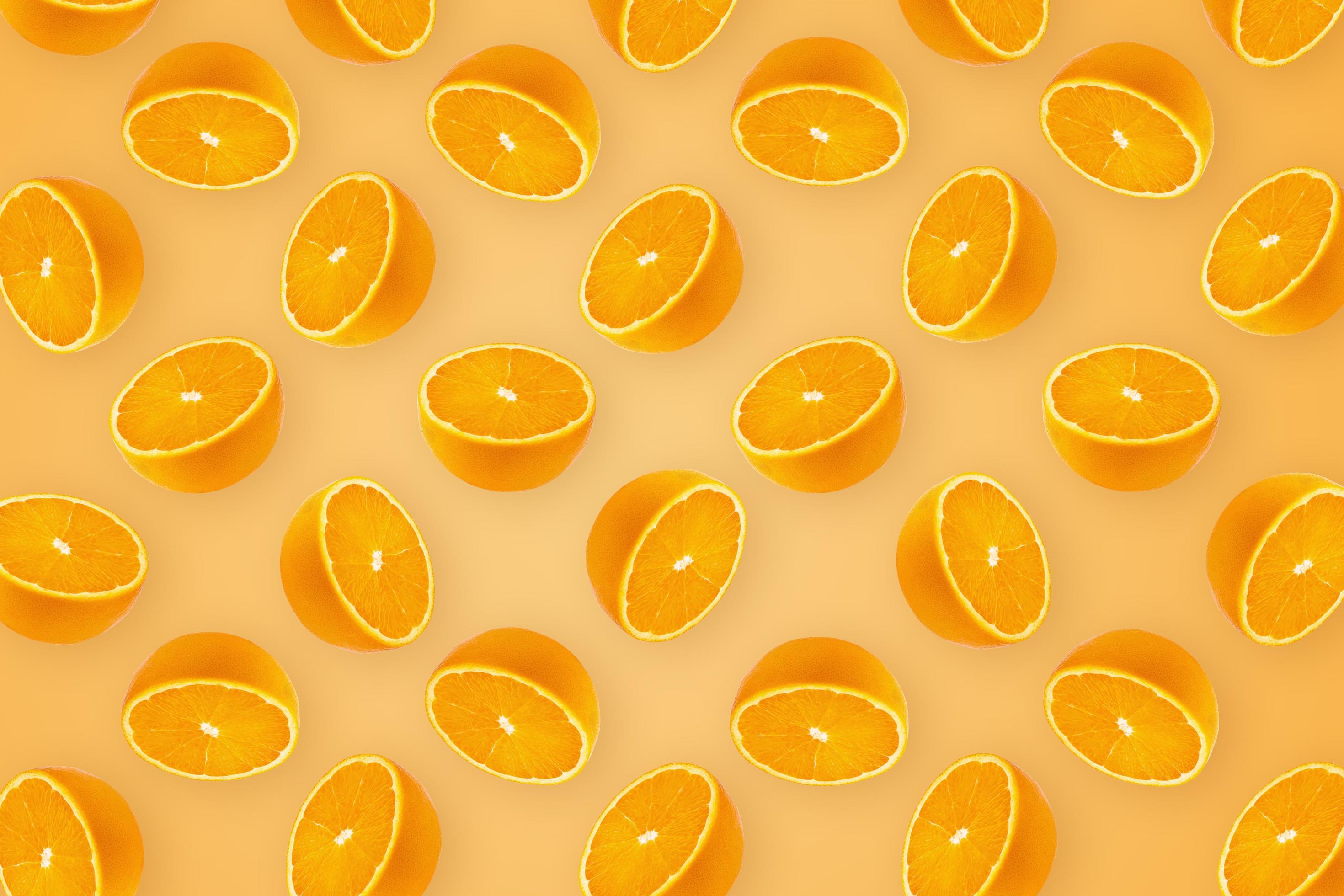 Oranges Fruit and Oranges Slices Healthy Food on orange wallpaper background Stock Free