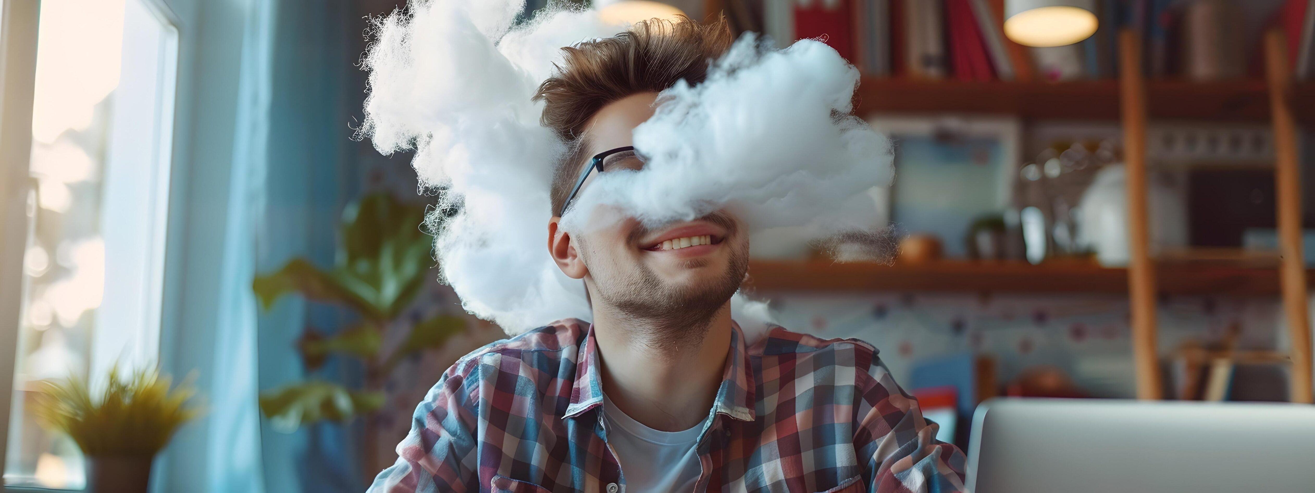 Millennial Vape Cloud Architect Relaxing and Working on Laptop in Modern Office Stock Free