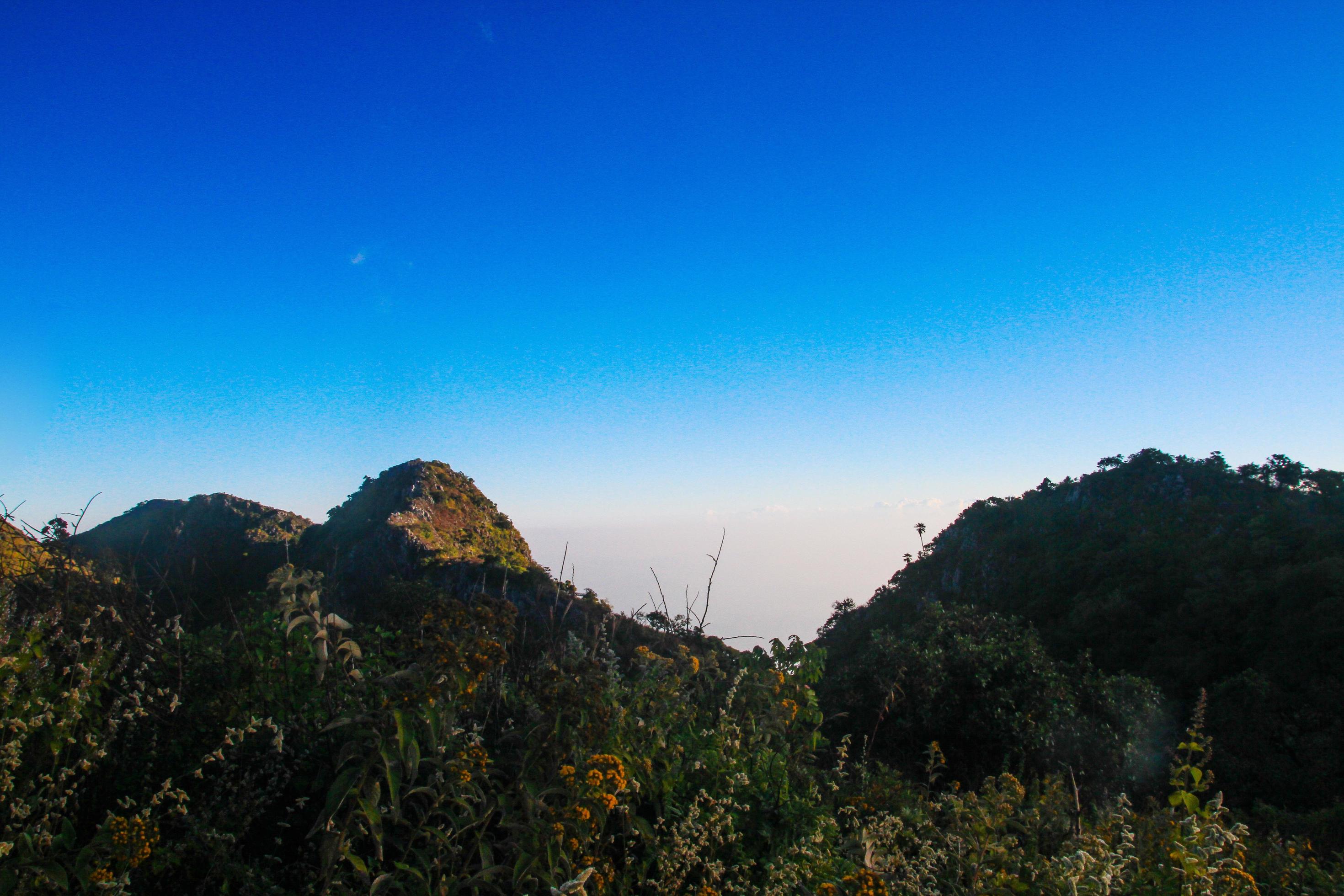 Sunrise in morning with sky and cloud on the Limestone mountain. Sunray with Fog and mist cover the jungle hill in Thailand Stock Free