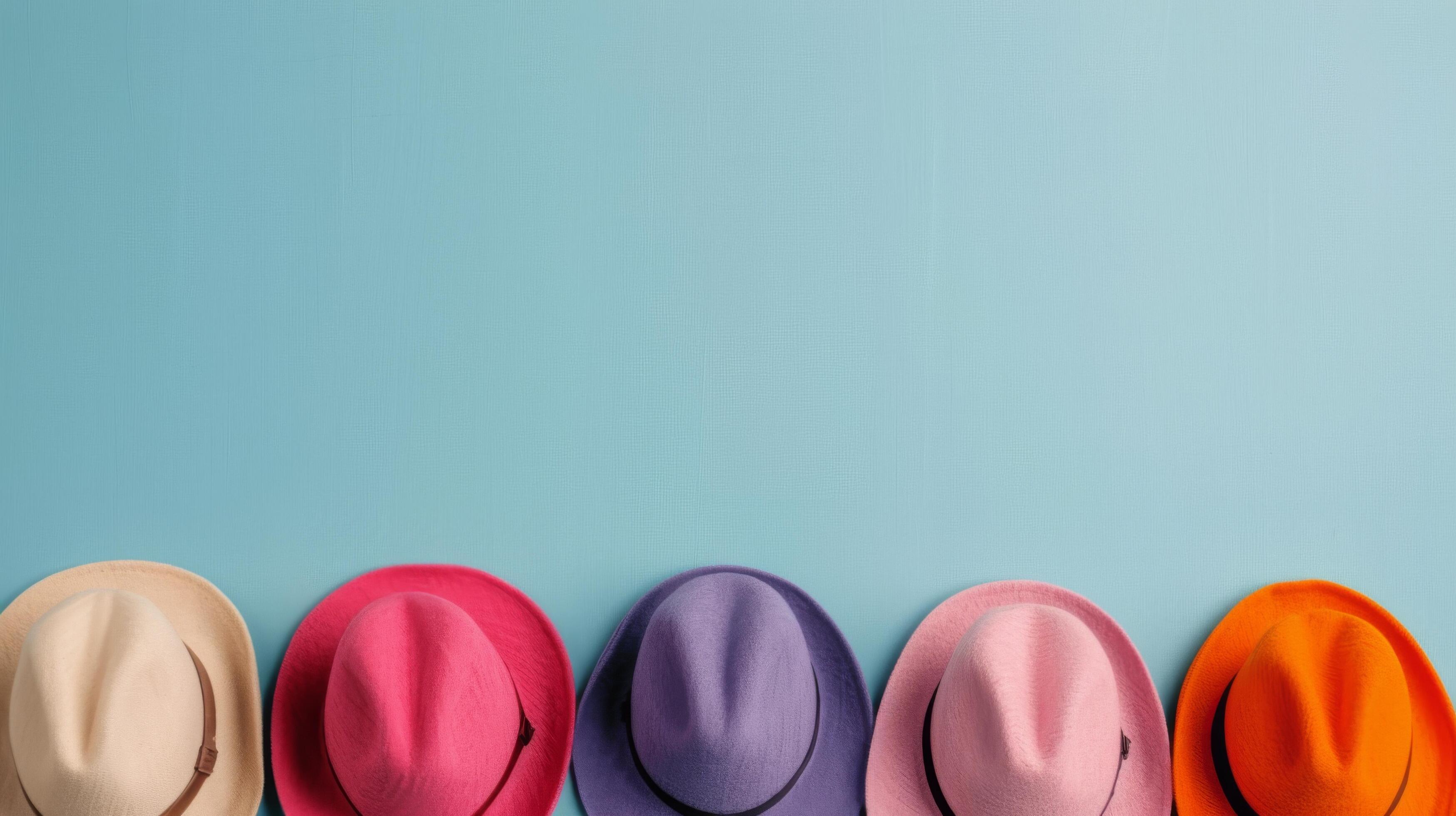 Colorful Straw Hats Arranged Neatly on a Blue Background Stock Free