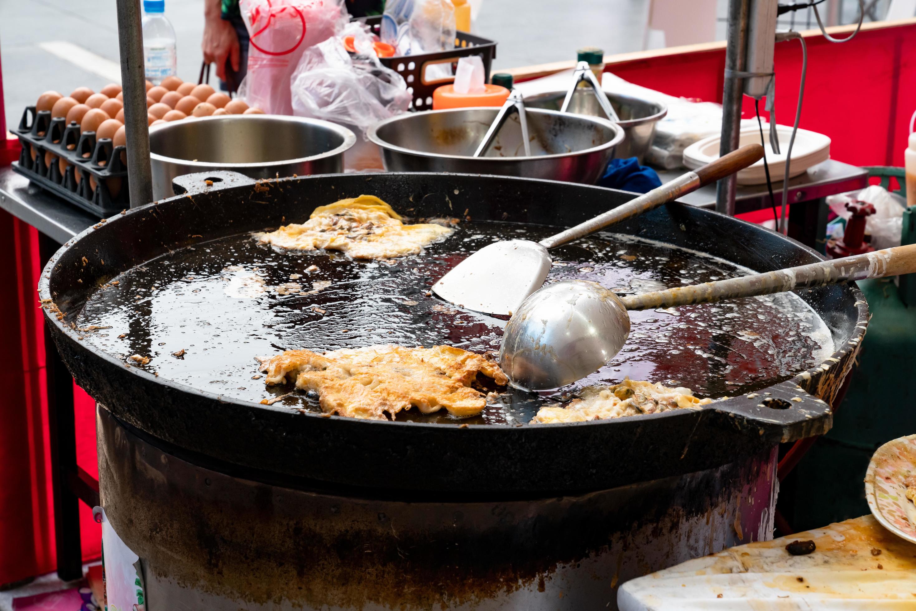 Thai oyster omelet or hoy tod on street food market Stock Free