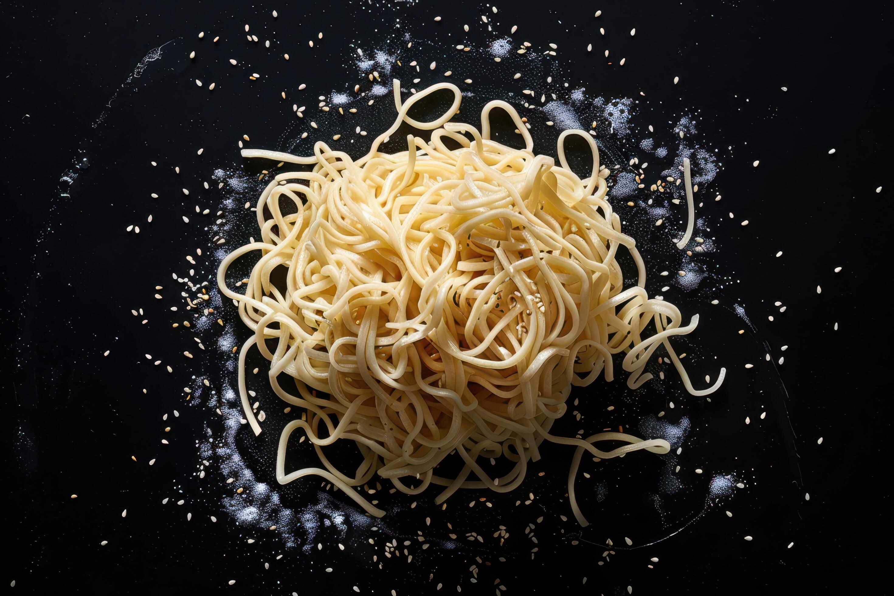 Noodles with Sesame Seeds on a Black Background Stock Free