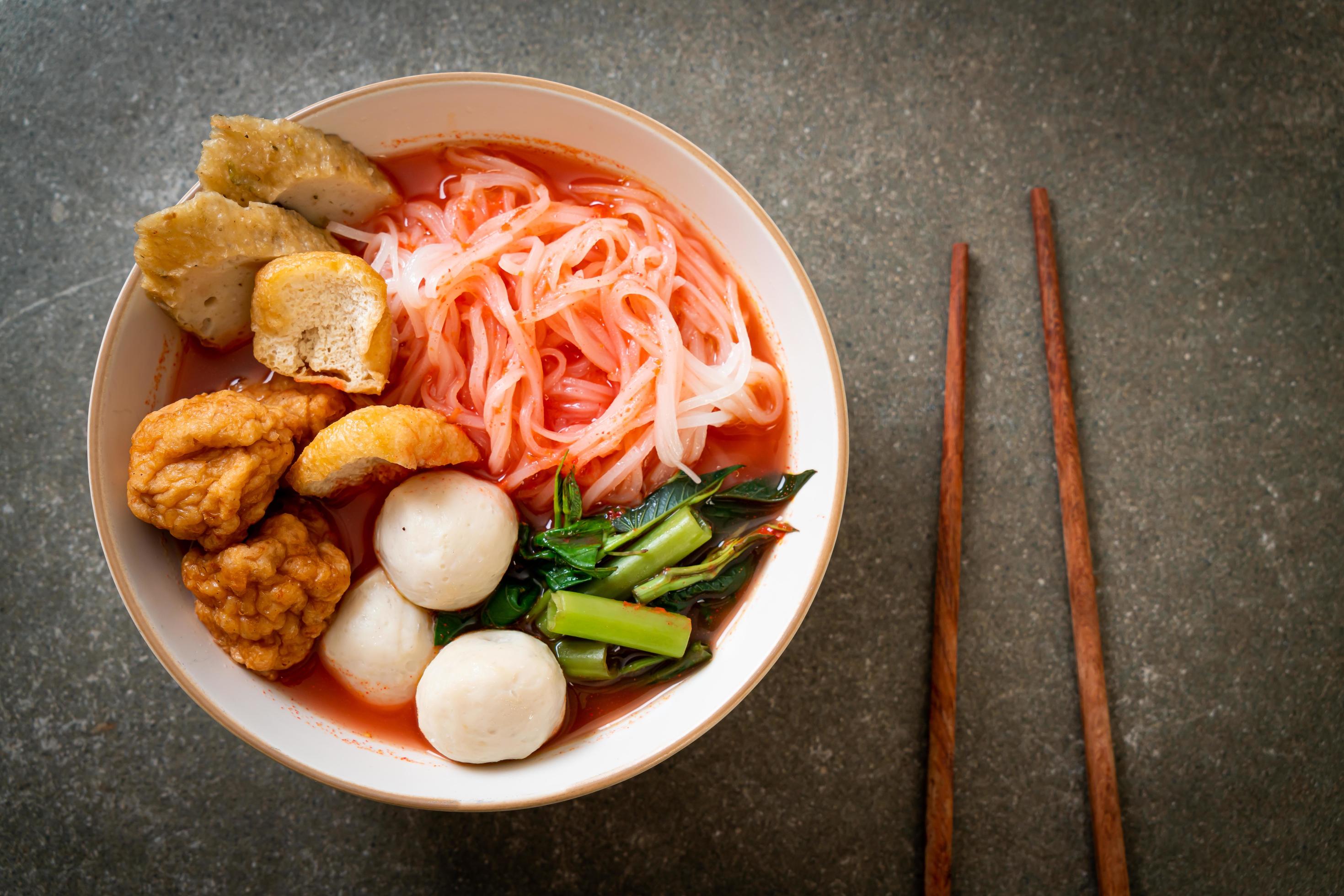 Small flat rice noodles with fish balls and shrimp balls in pink soup, Yen Ta Four or Yen Ta Fo – Asian food style Stock Free