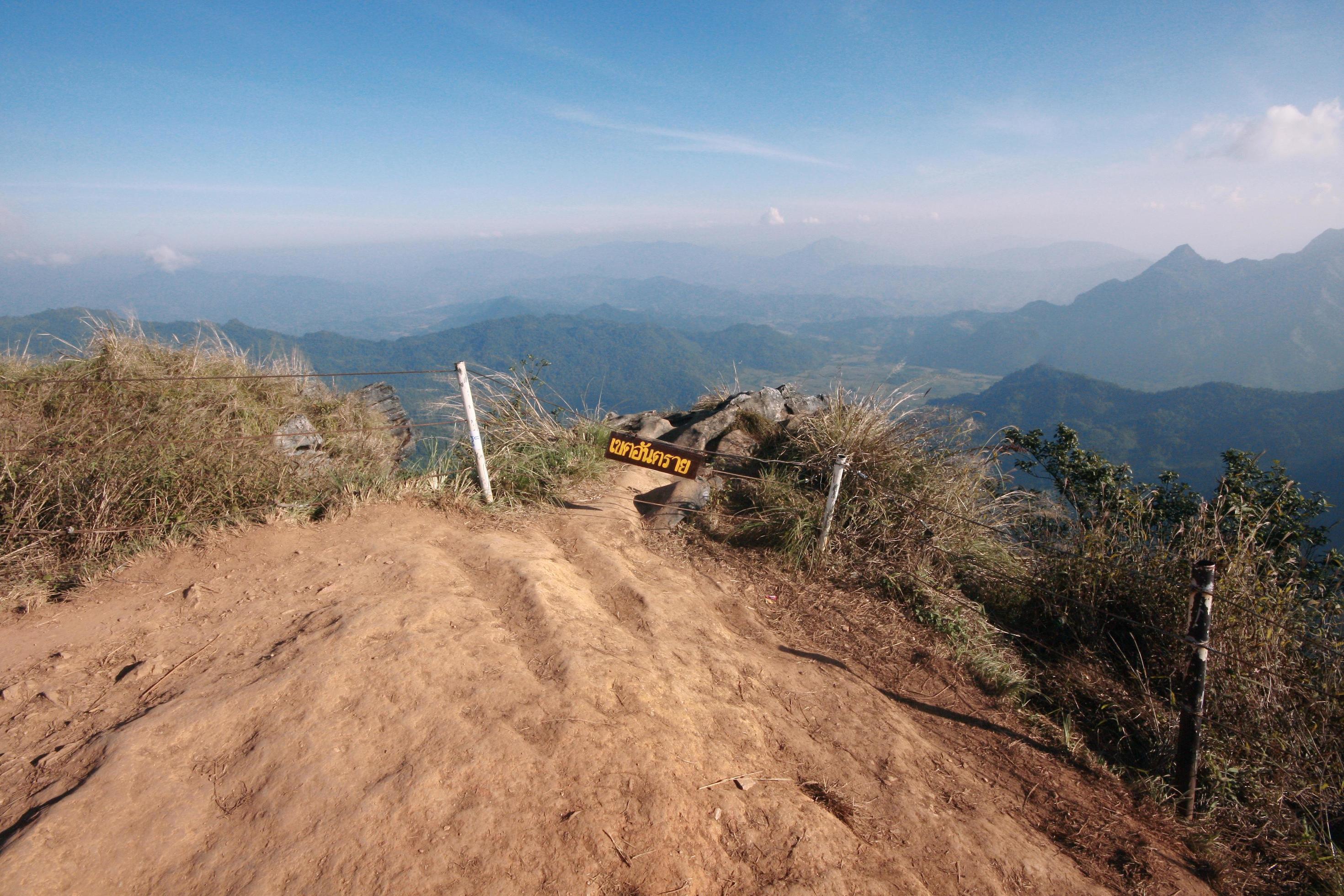 Warning sign label in Thai characters Wrote that mean Danger Zone on the mountain in Thailand Stock Free