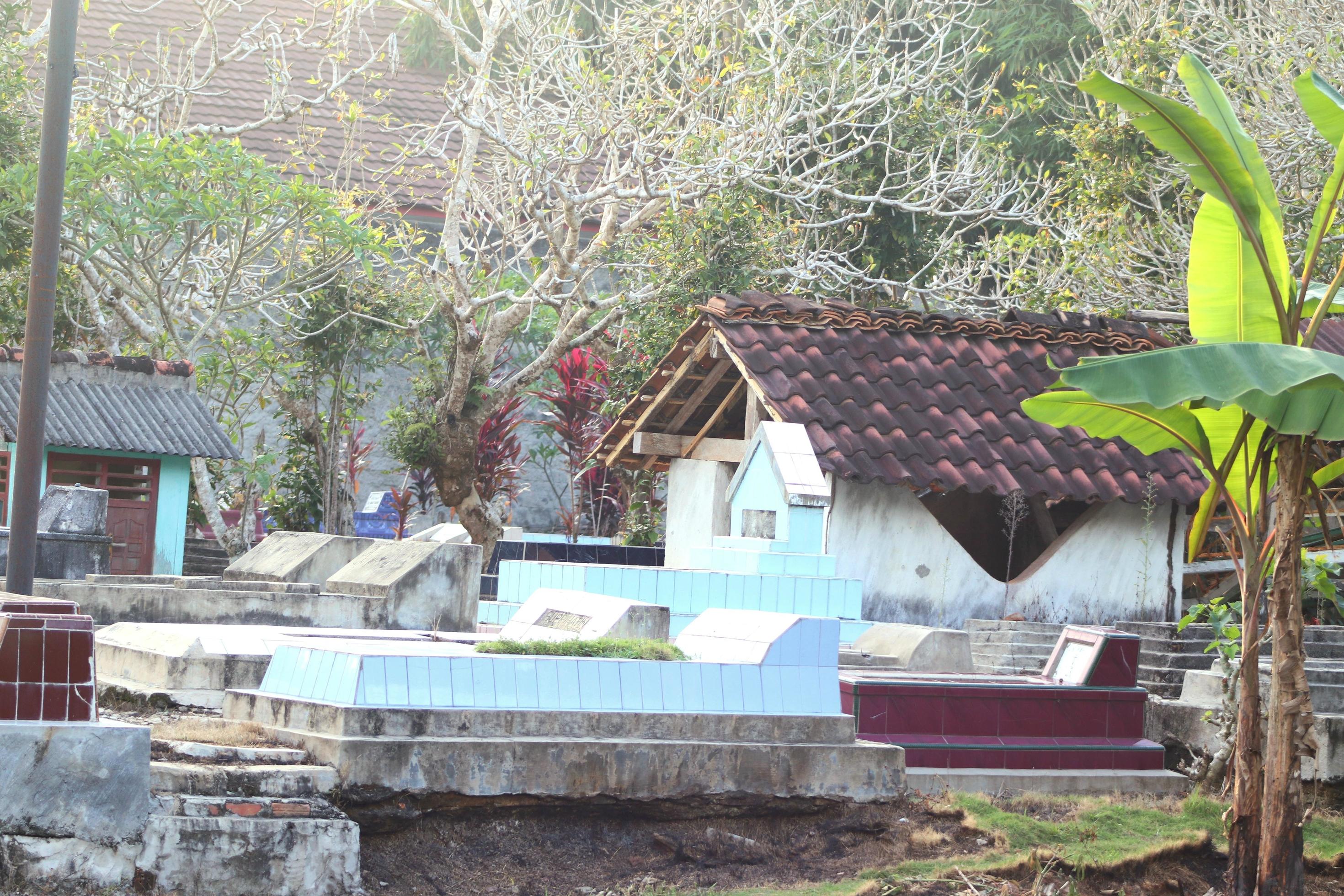 Historic place of public cemetery with natural floral background of buildings and trees Stock Free