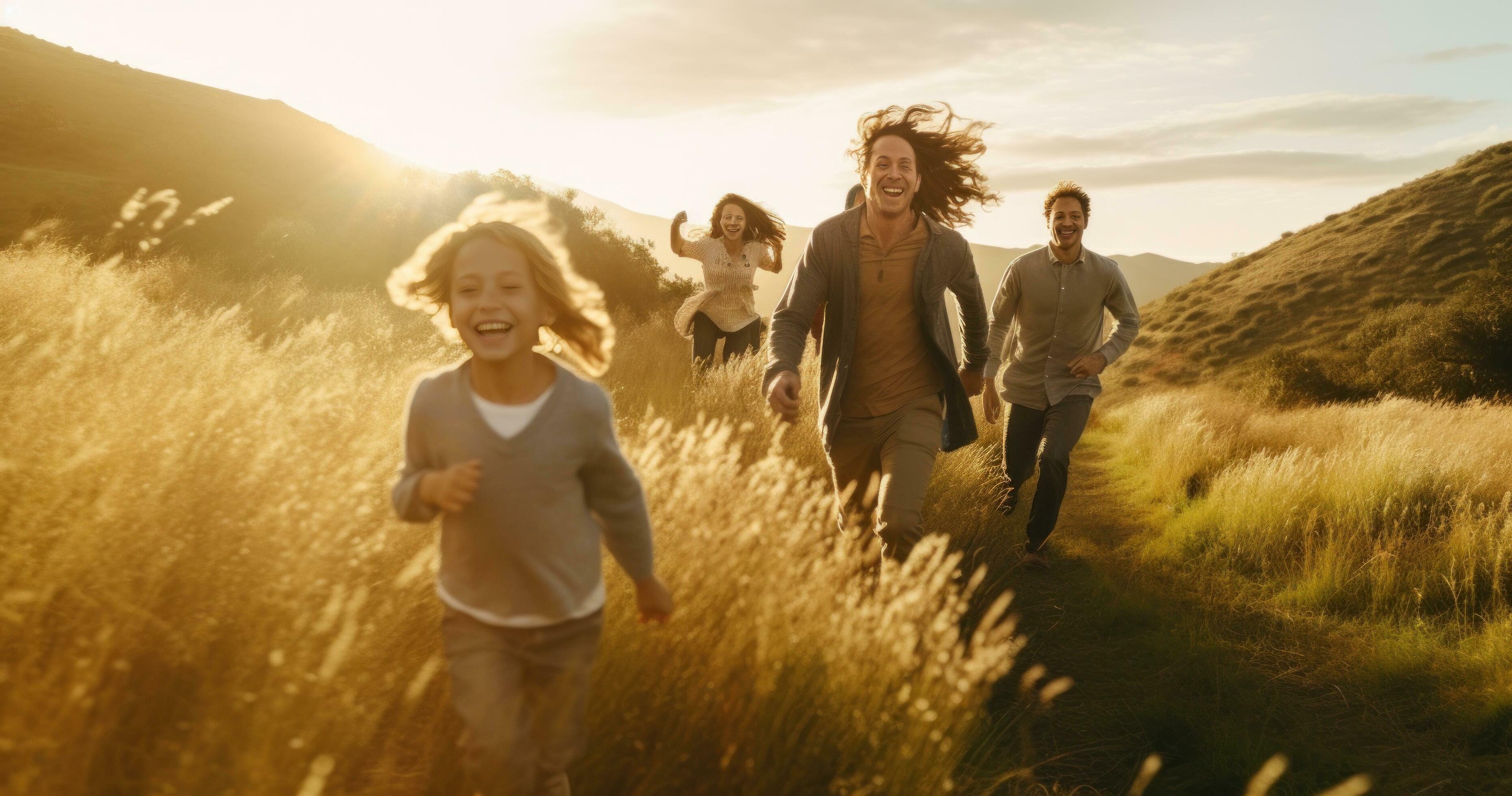 Happy family in running in summer field Stock Free