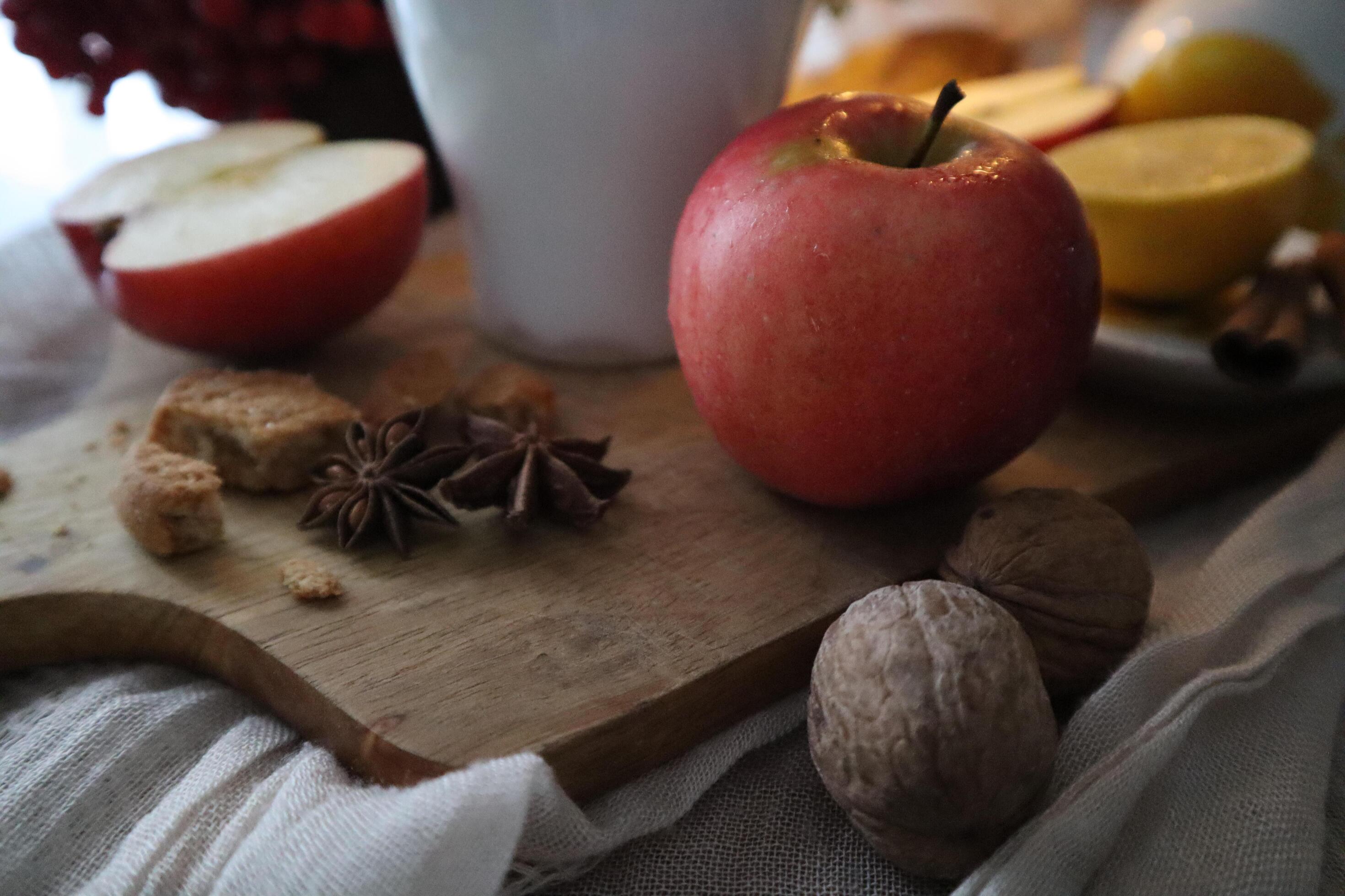 Autumn food photography composition Red apples, viburnum berries on a wooden cutting board Stock Free