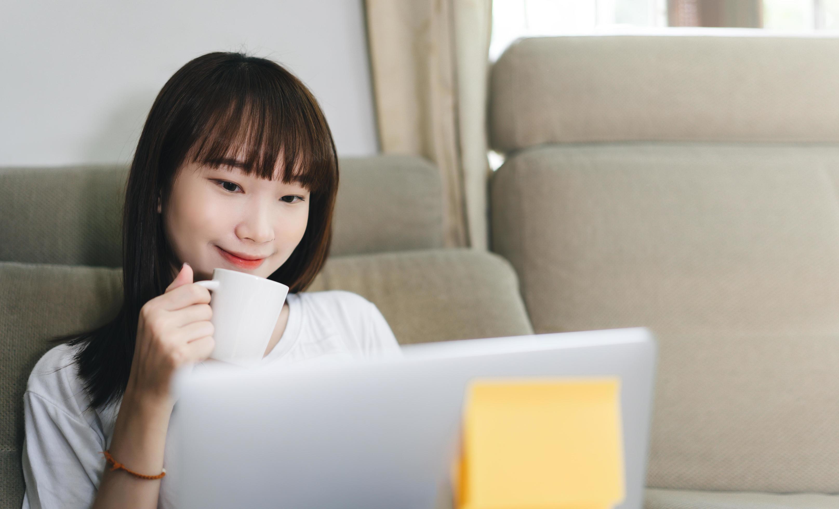 Asian teenager student woman learning via internet with laptop in new normal lifestyle. Stock Free