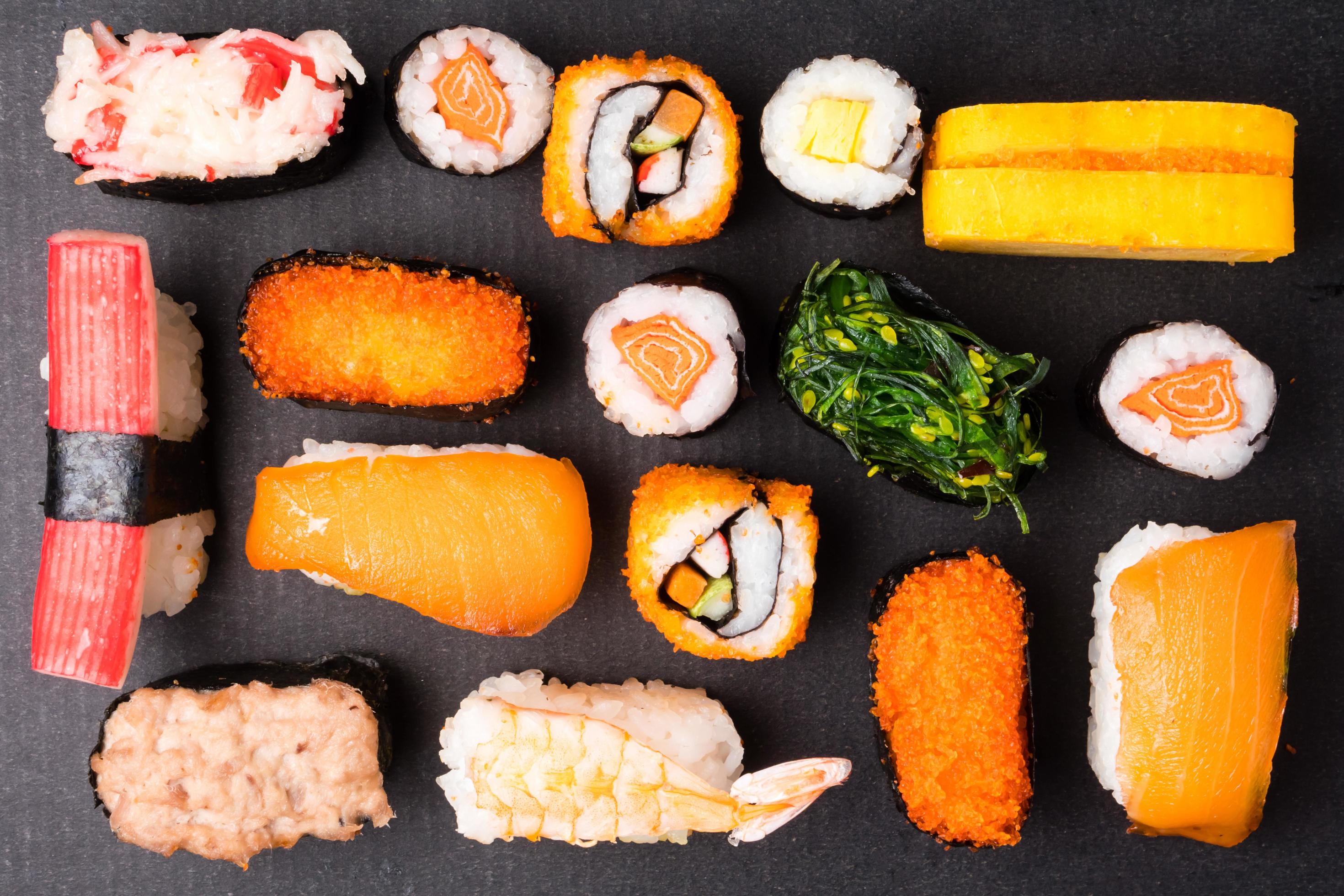 Top view of Sushi set on black background, Japanese food. Stock Free