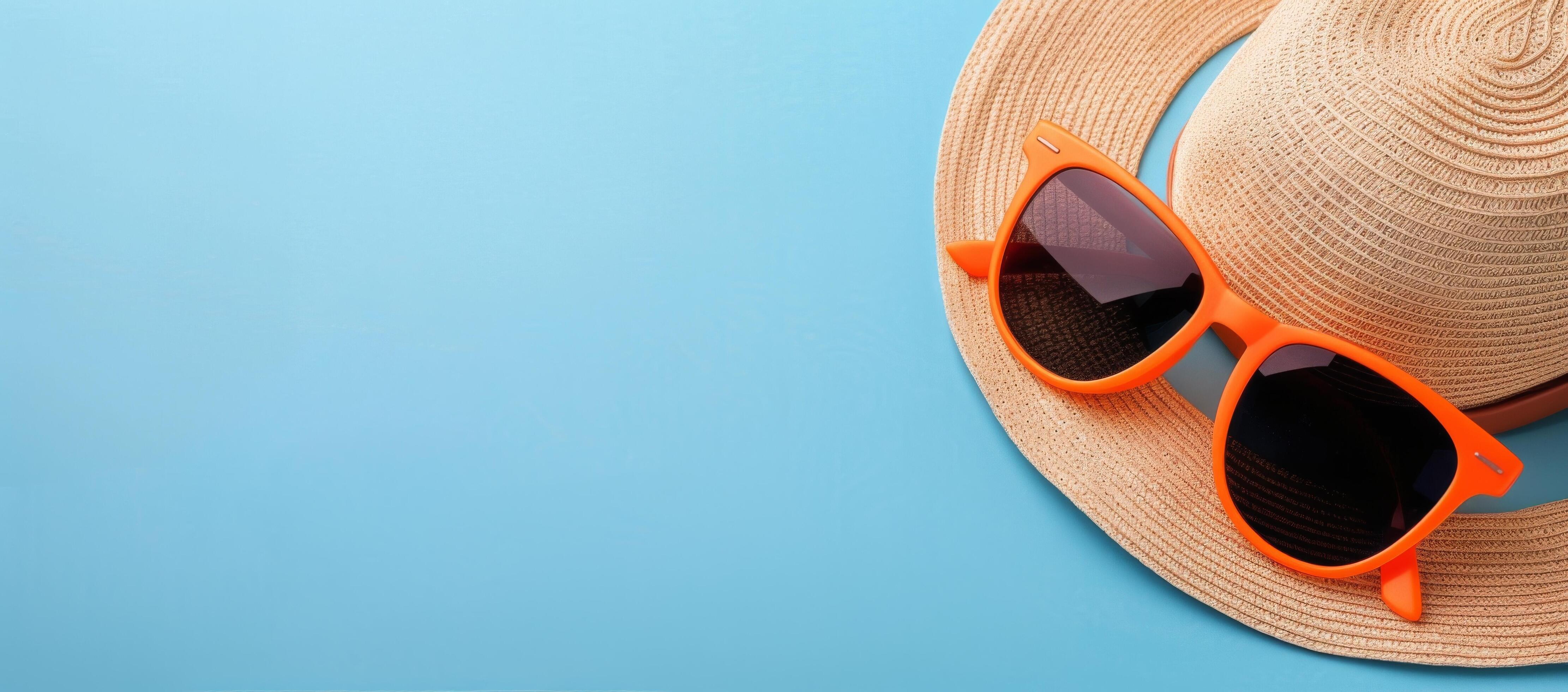 Summer Accessories With Orange Sunglasses And Straw Hat On Turquoise Background Stock Free