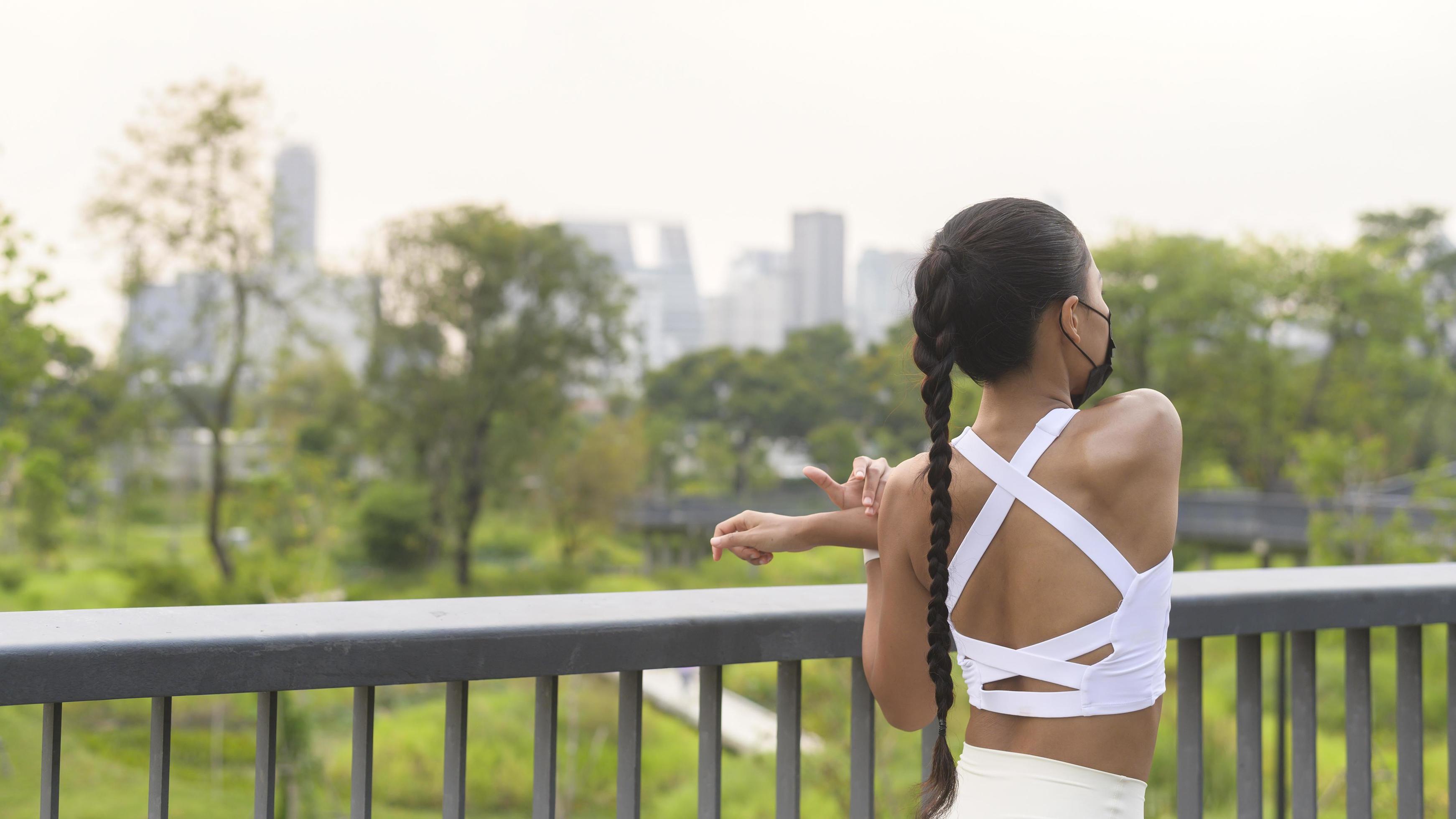 Young fitness woman in sportswear wearing face mask while exercise in city park, Health and Lifestyles. Stock Free