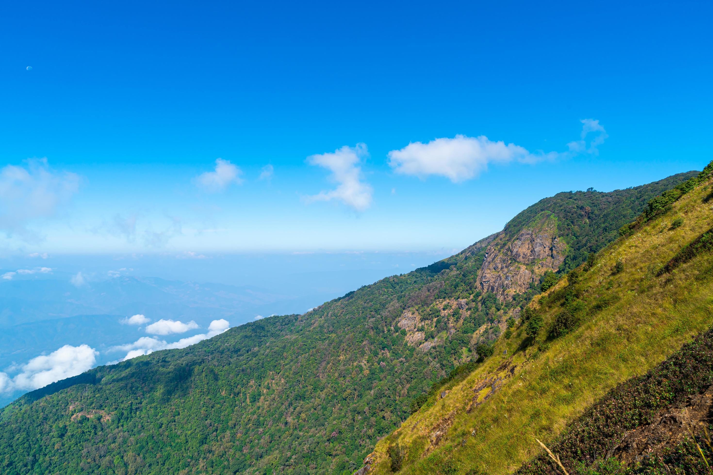 Beautiful mountain layer with clouds and blue sky at Kew Mae Pan Nature Trail in Chiang Mai, Thailand Stock Free