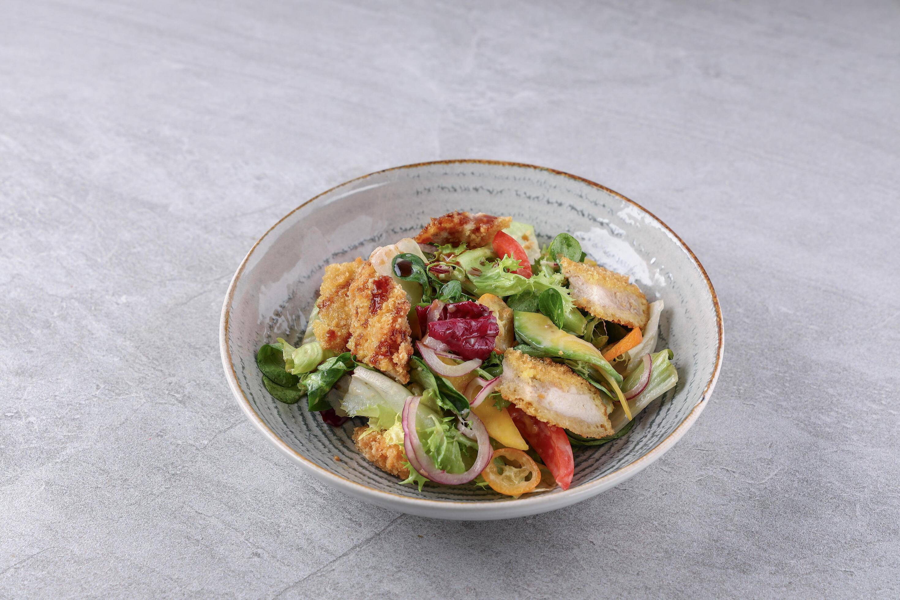 bowl with shrimp in batter, avocado and kumquat on a stone background, studio food photography 1 Stock Free