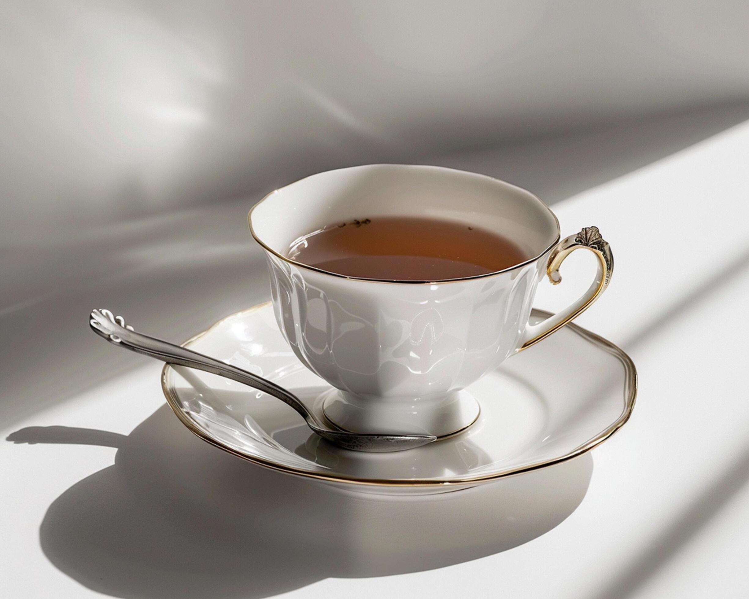 a cup of tea sits on a saucer Stock Free