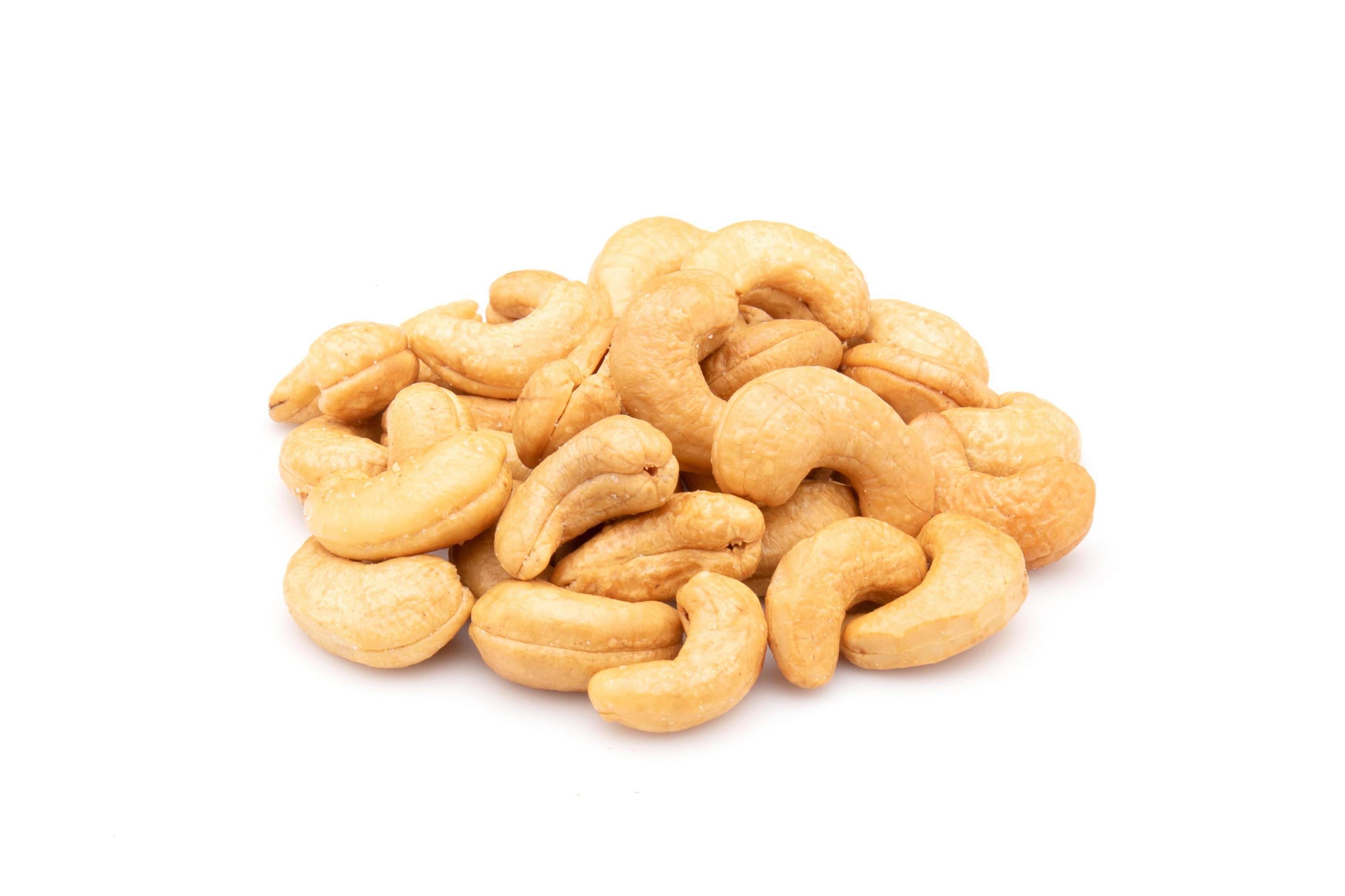 Pile of roasted cashew nut isolated on white background. Food concept Stock Free