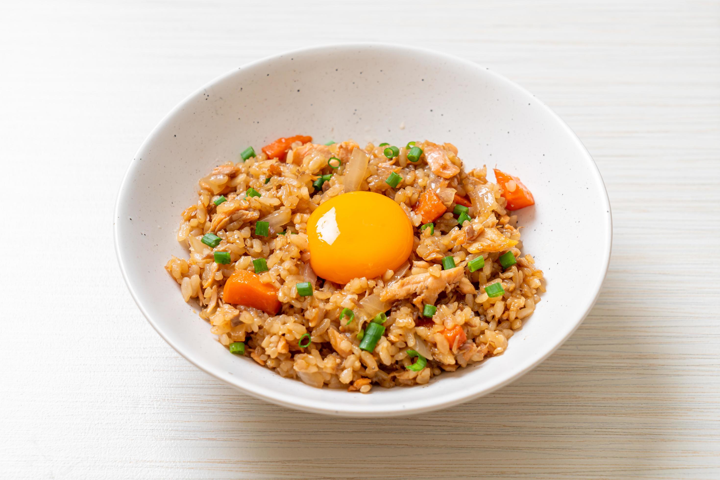 Salmon fried rice with pickled egg on top – Asian food style Stock Free