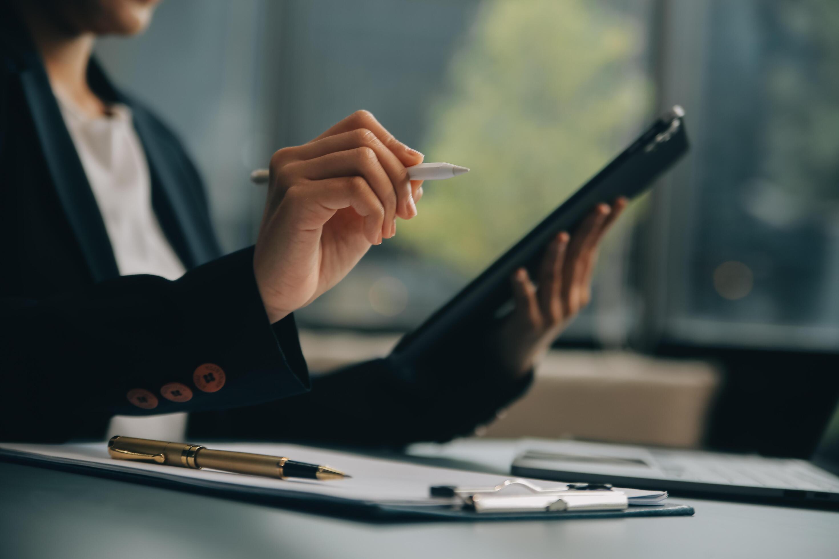 Portrait of a successful business woman using digital tablet Stock Free