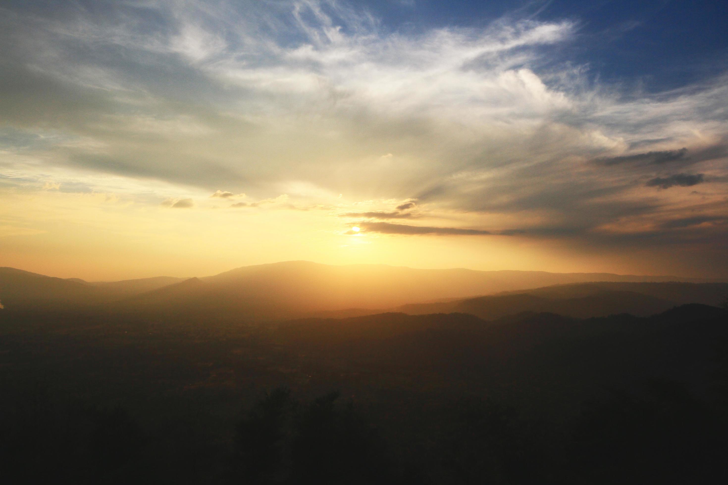 Beautiful landscape layers of mountain and Misty on hill valley in golden twilight of sunset at Thailand Stock Free