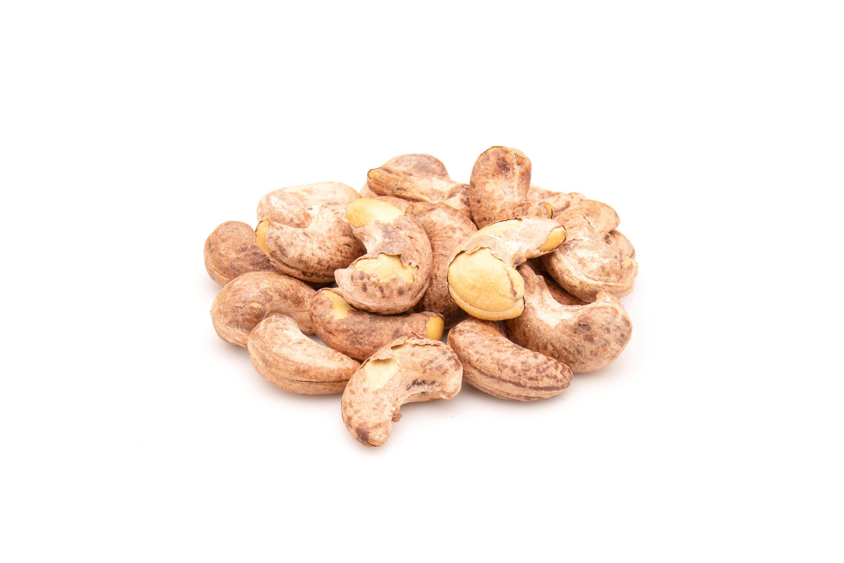 Pile of roasted cashew nut isolated on white background. Food concept Stock Free