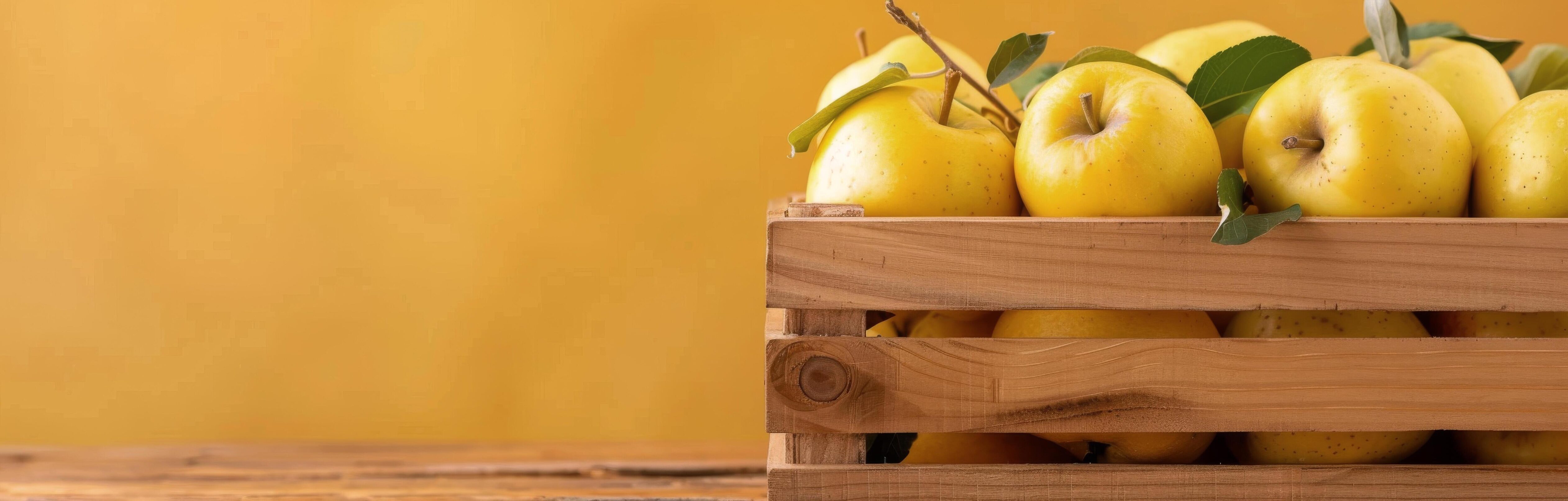 Fresh Yellow Apples in Wooden Crate on Rustic Table With Yellow Background Stock Free