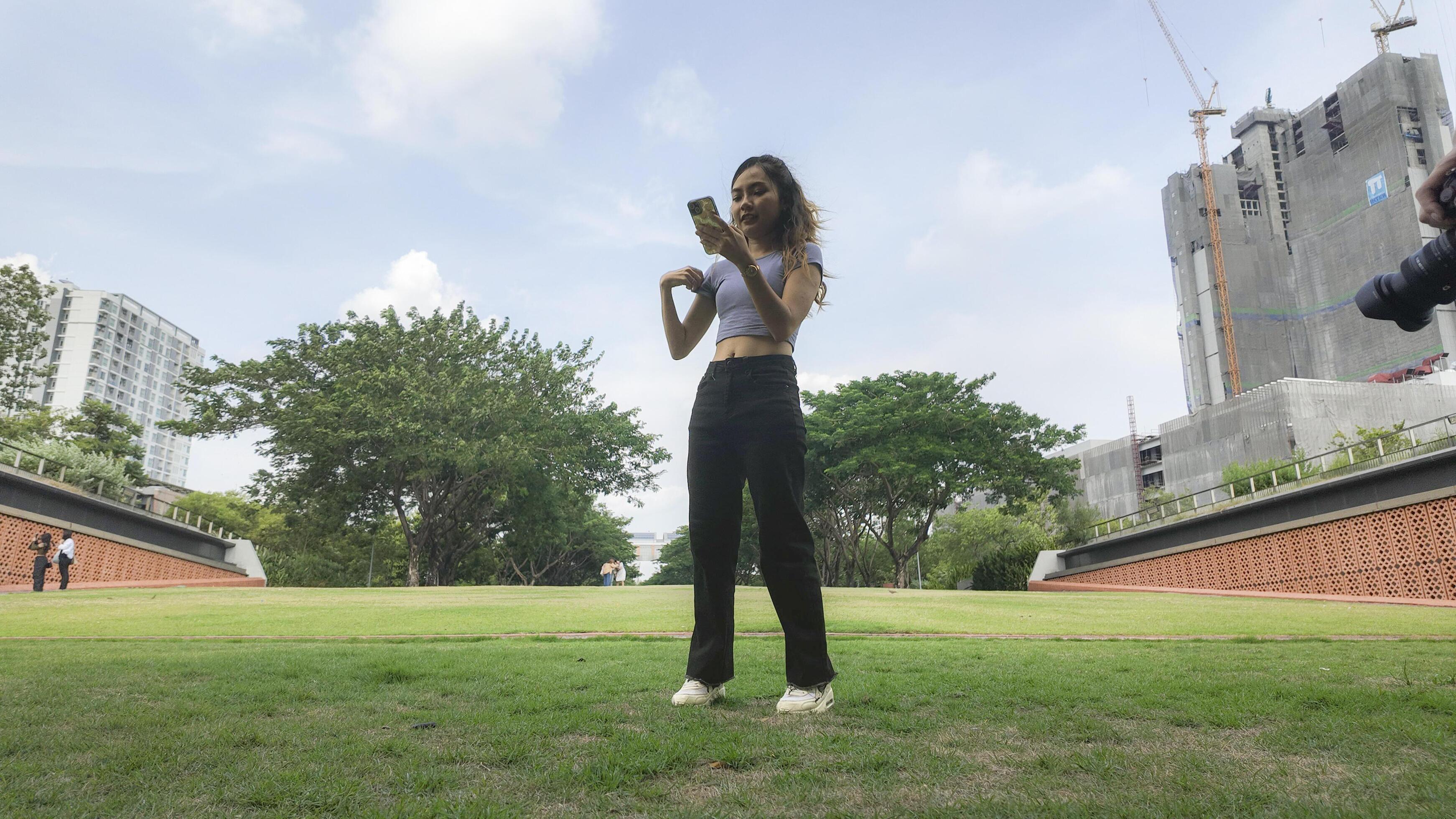 Asian women do freestyle hip hop and breakdancing in a public space in the middle of the city. With a cheerful and happy attitude Stock Free