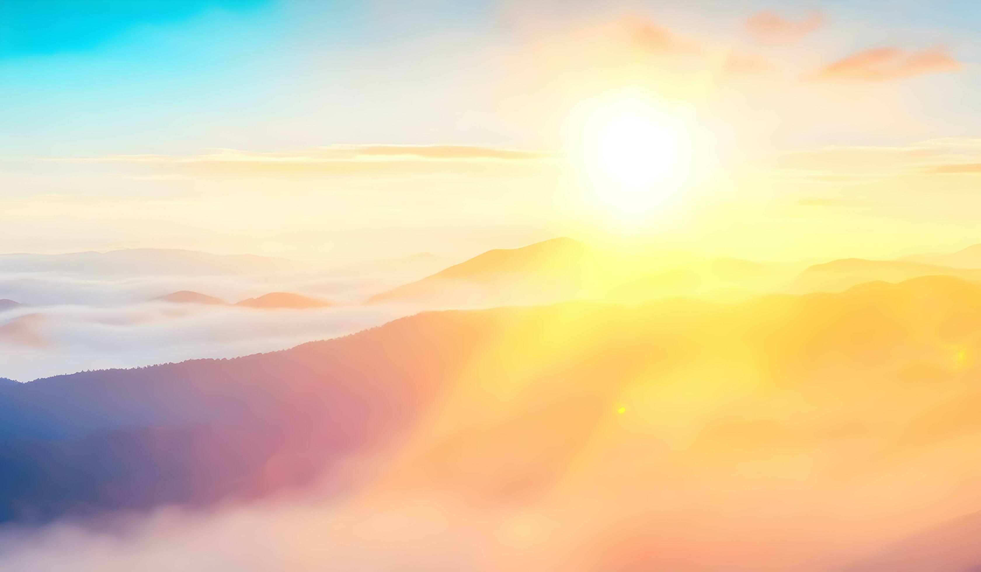 Natural fog and mountains sunlight background. Misty waves warm colors and bright sun light. Christmas background sky sunny color Stock Free