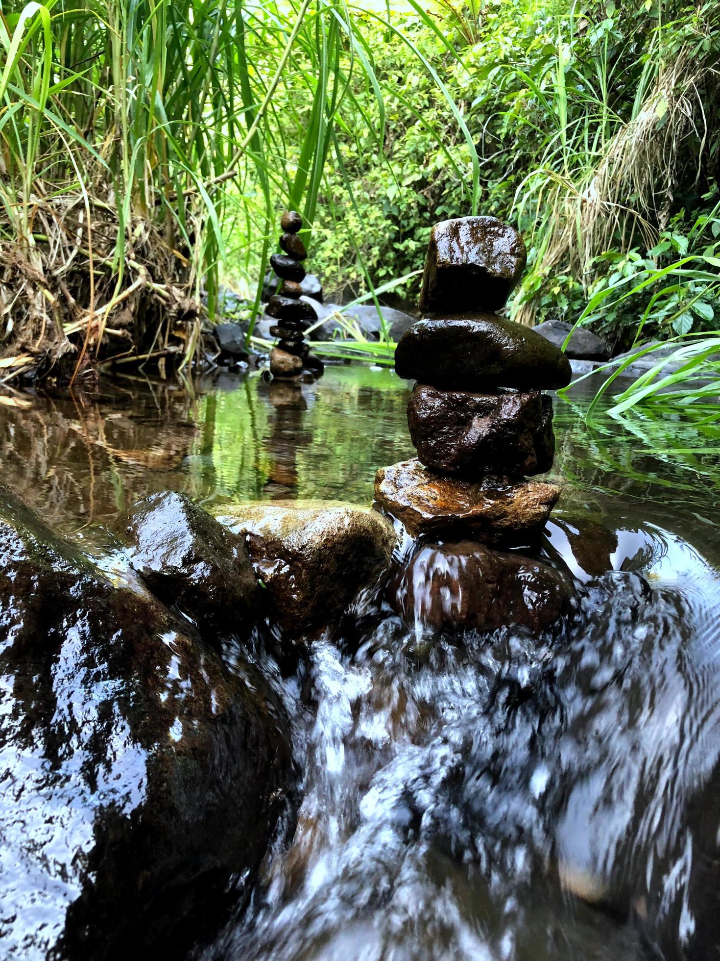 Balanced zen rock stacks in a creek. Stock Free