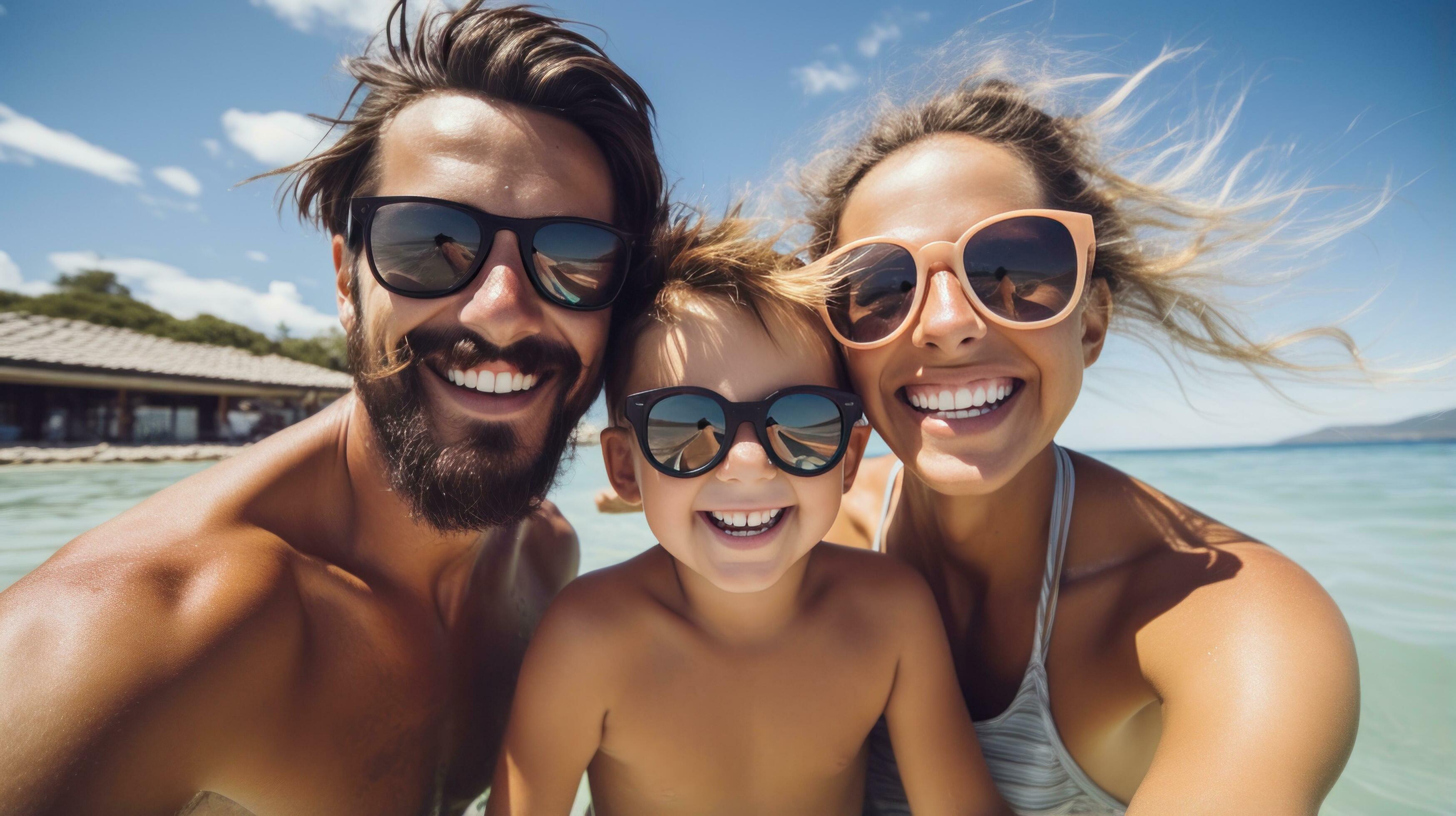 Happy family having fun in the pool on a sunny day Stock Free