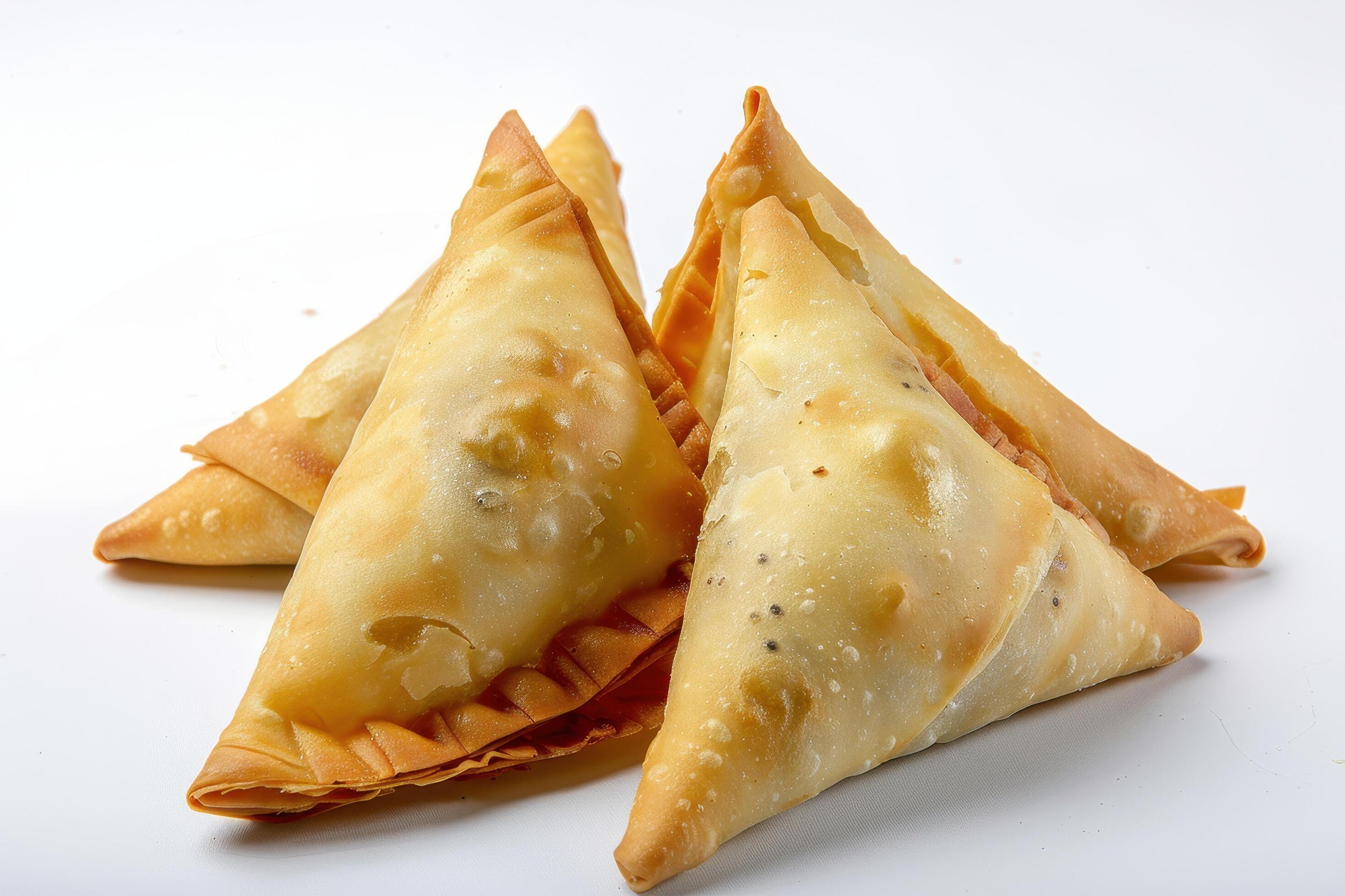 Three Golden Brown Fried Samosas on White Background Stock Free