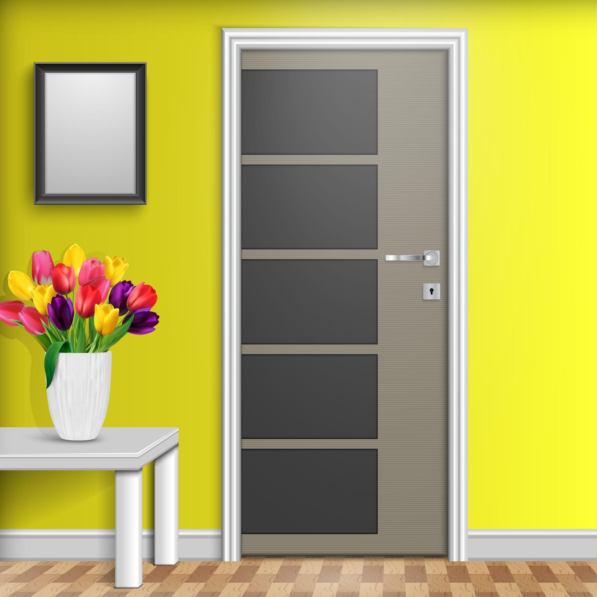 Closed door with vase and flowers over white table isolated on yellow wall background Stock Free