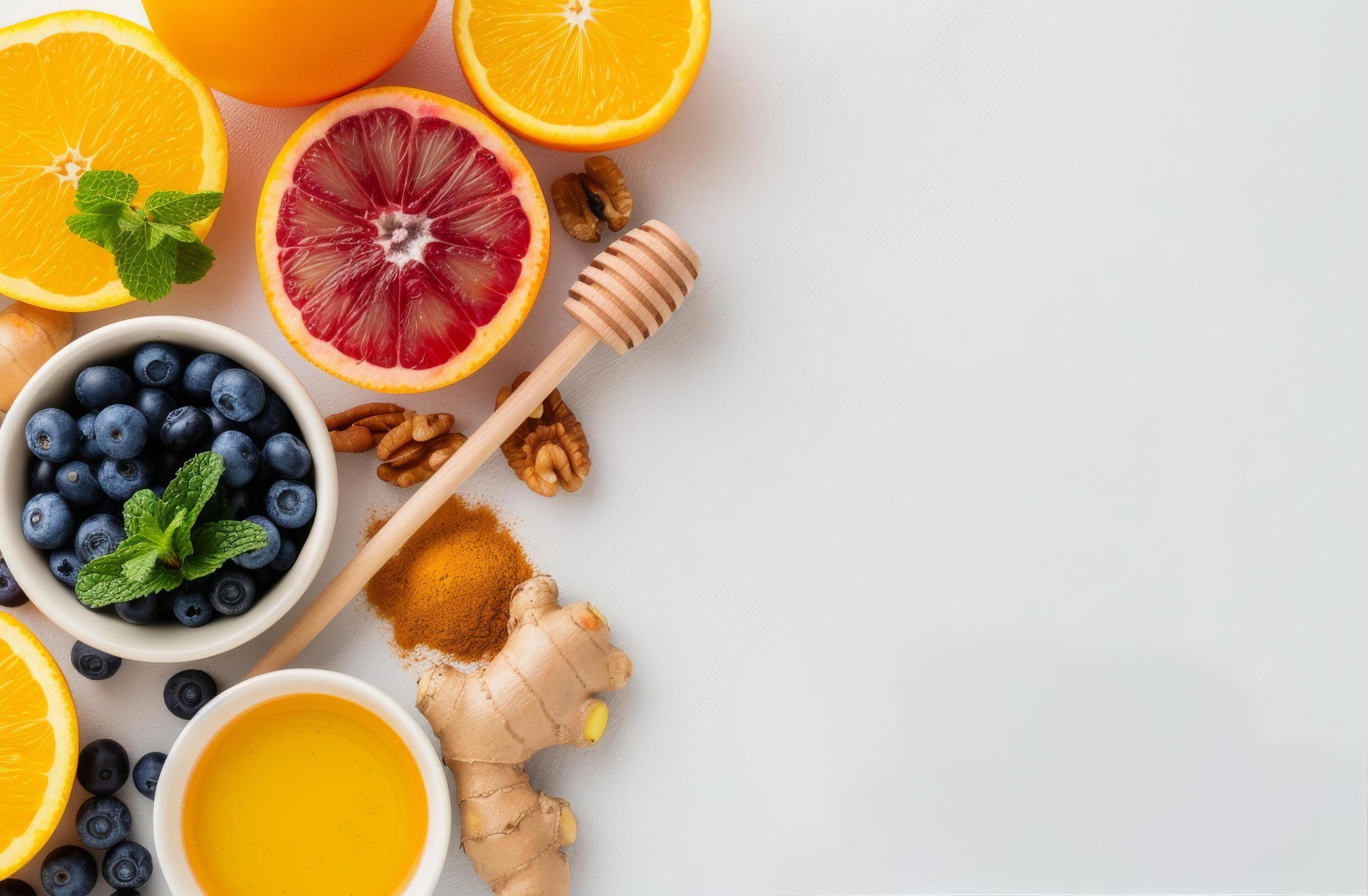 Citrus Fruit, Honey, Ginger, and Blueberries on White Background Stock Free