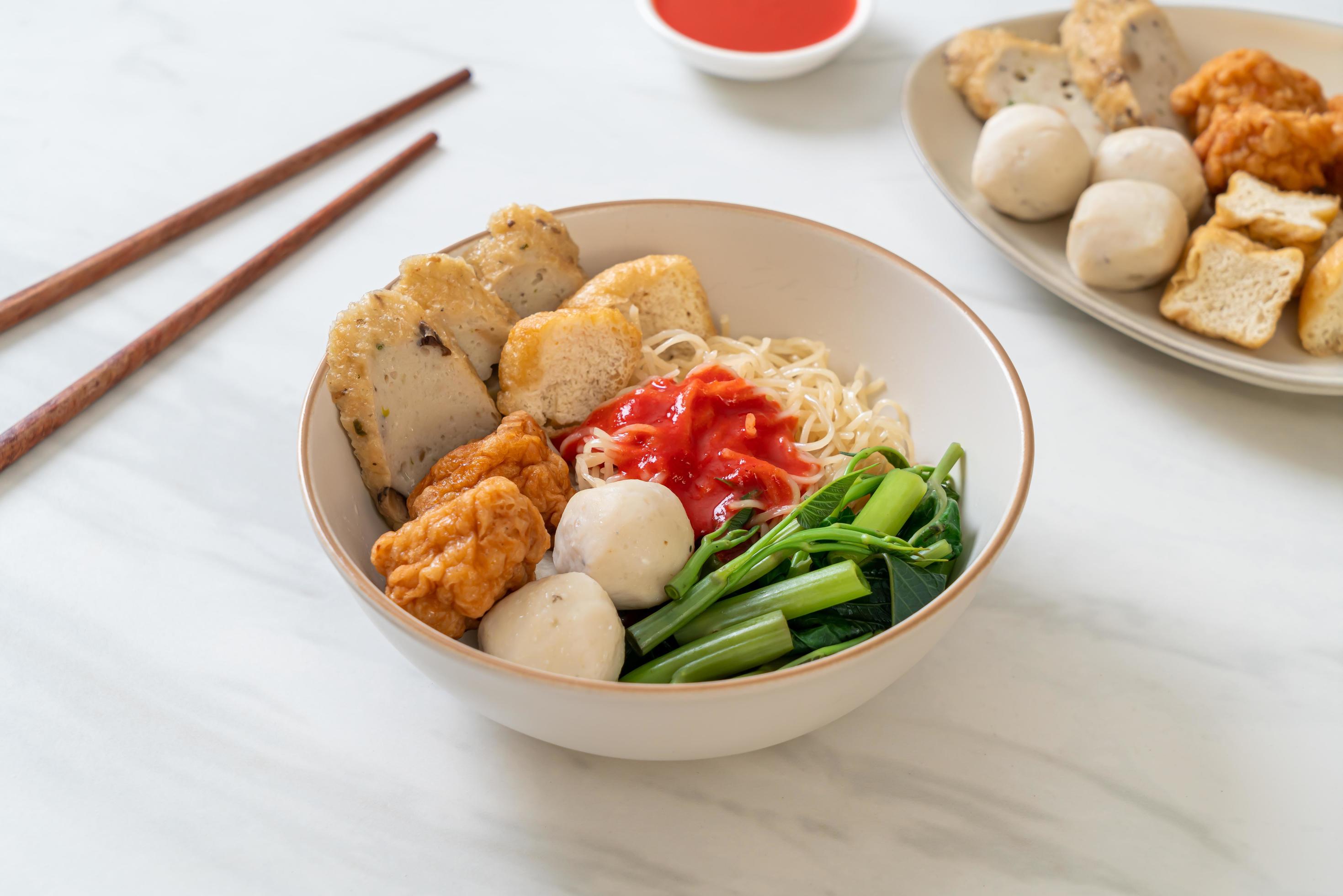 Egg noodles with fish balls and shrimp balls in pink sauce, Yen Ta Four or Yen Ta Fo – Asian food style Stock Free