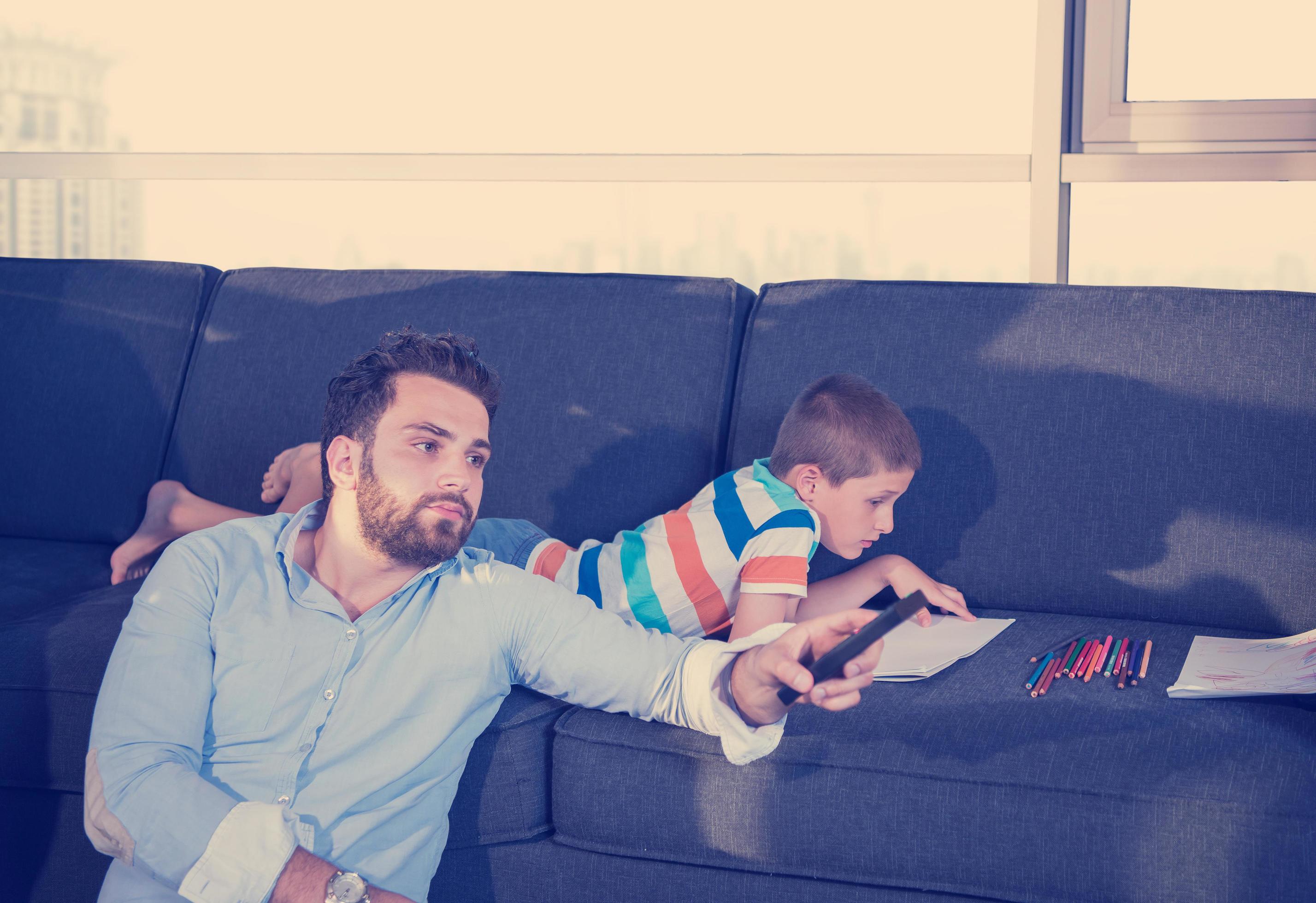 Happy Young Family Playing Together on sofa Stock Free