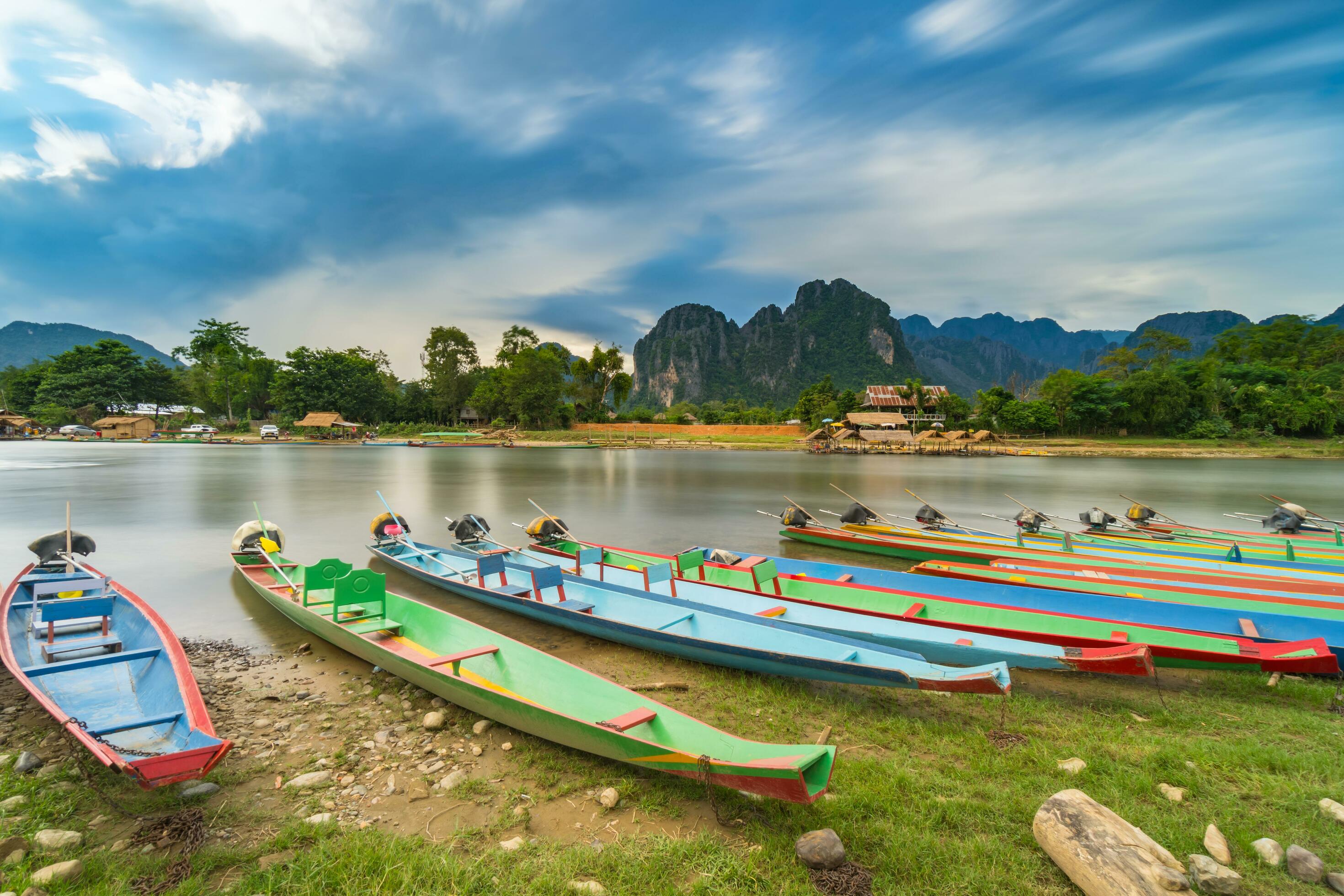 
									Long exposure and long tail boats on naw song river in Vang vieng, Laos. Stock Free