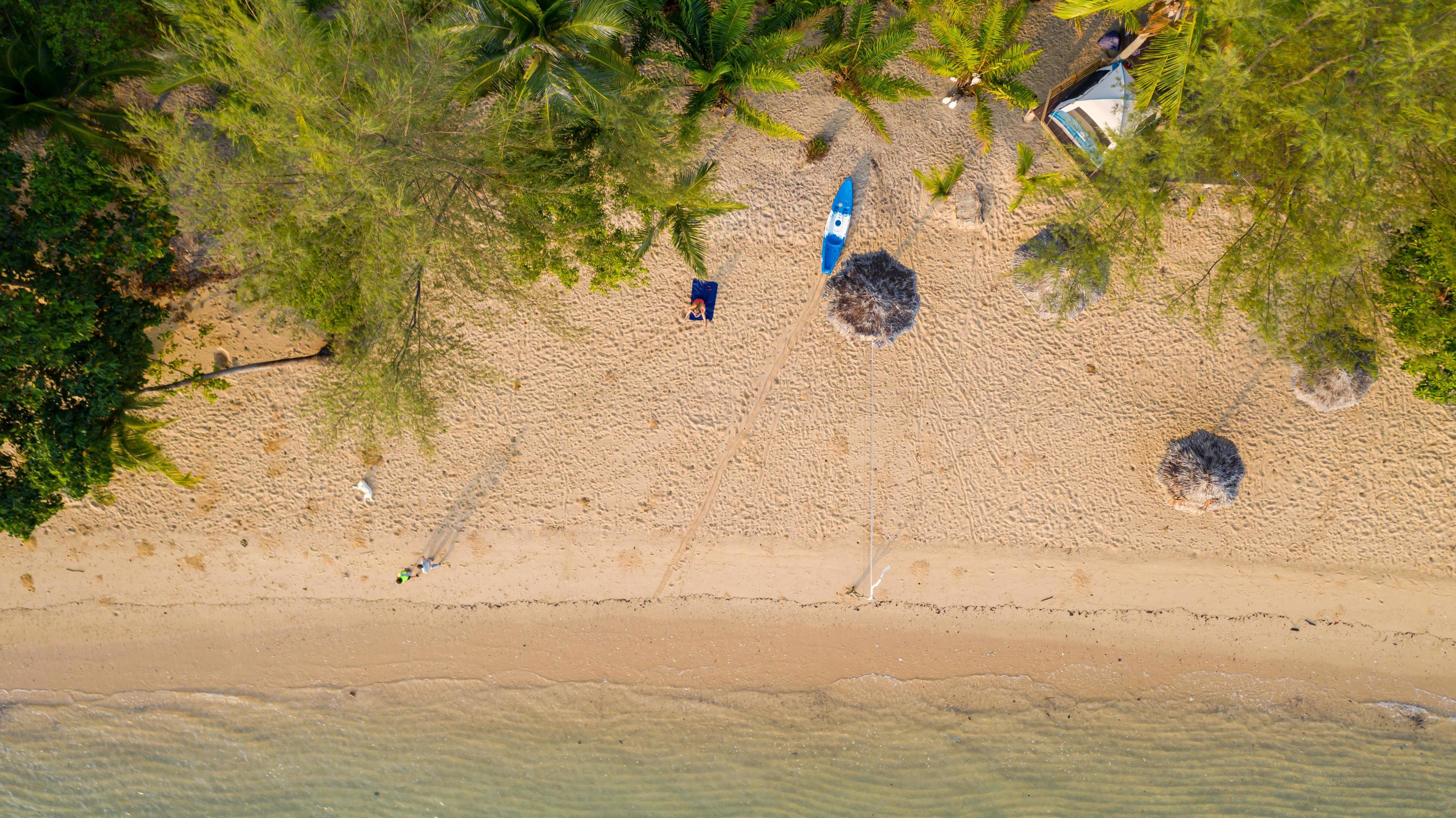 Aerial view Sea view Amazing thailand nature background Water and beautifully bright beach with kayak on ocean at sunny day Stock Free